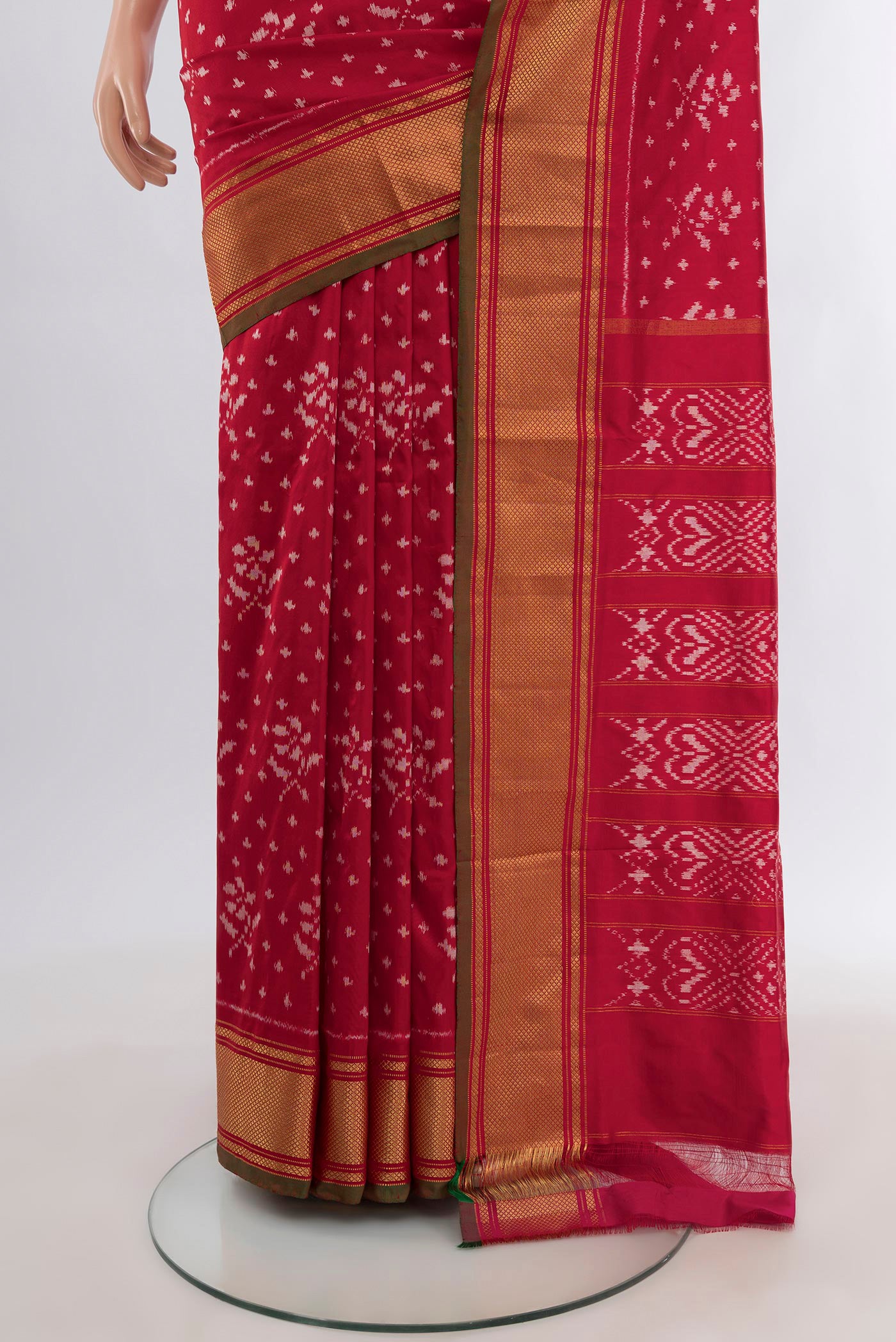 Pleats and pallu of Red Pochampally Silk Saree with Ikat design on the body and Zari Border. 