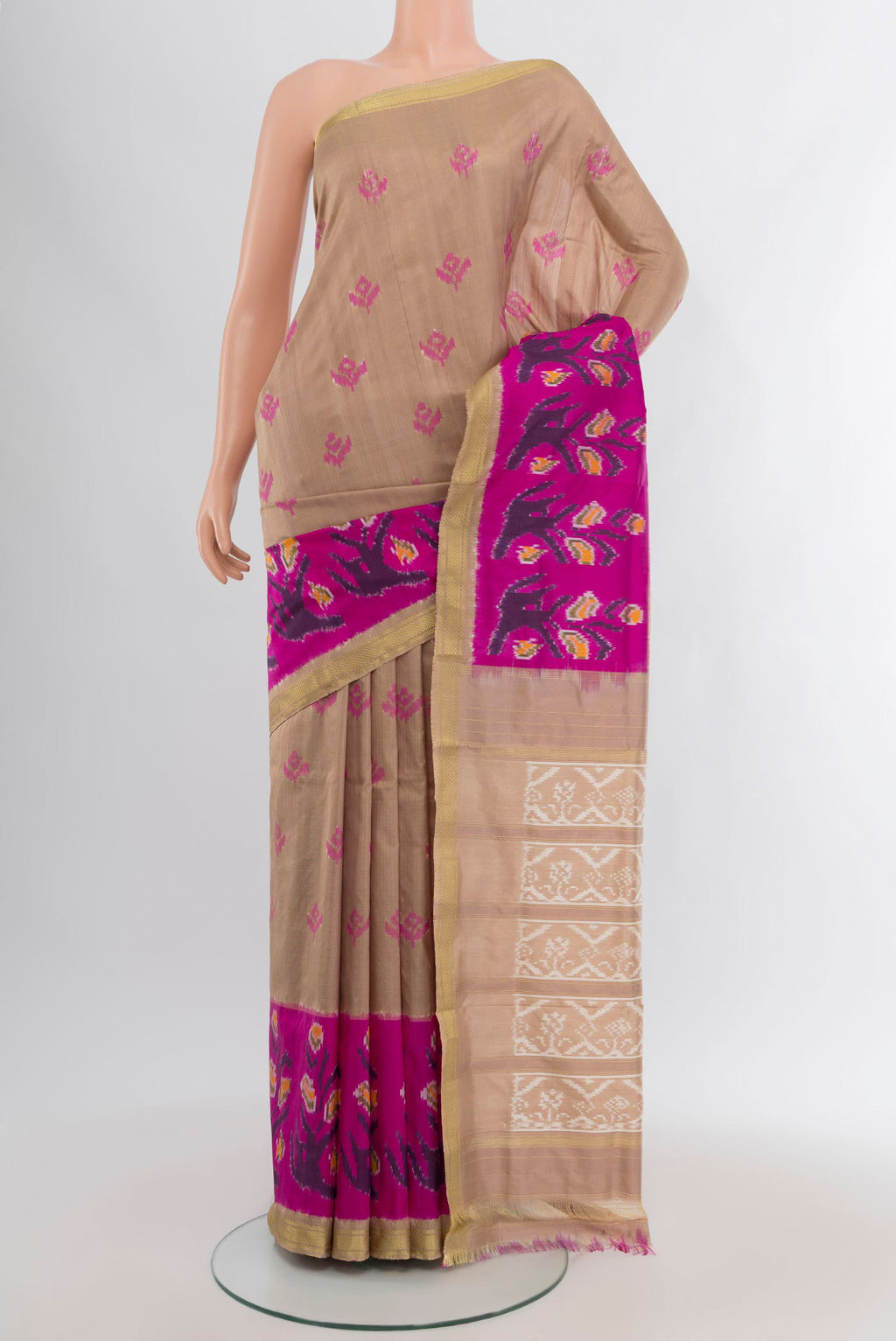 Dark Beige Pochampally Silk Saree with Pure Ikat on the body and Ikat Border.  displayed on a mannequin