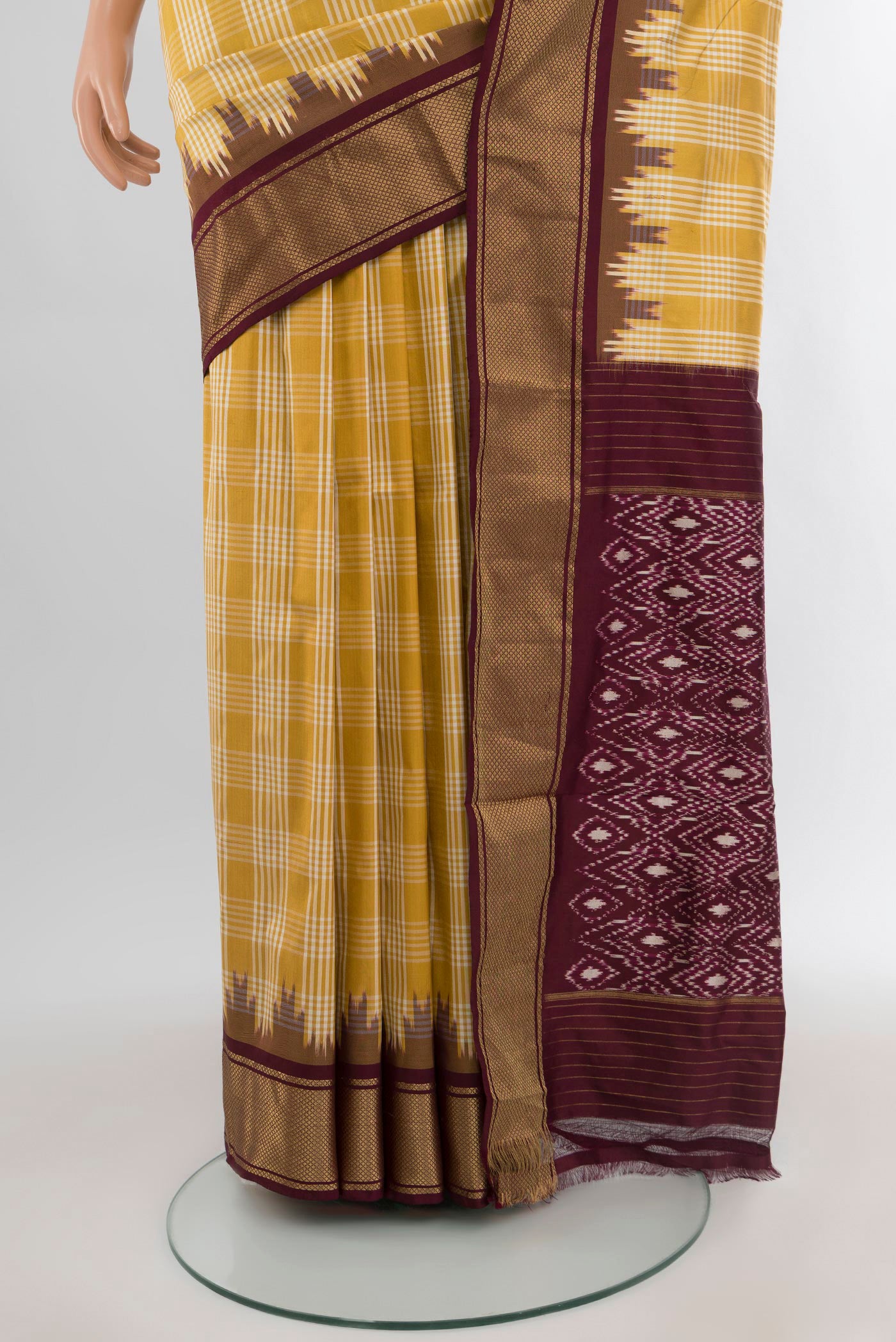 Pleats and pallu of Yellow Pochampally Silk Saree with Ikat Print on the body and Zari Border. 