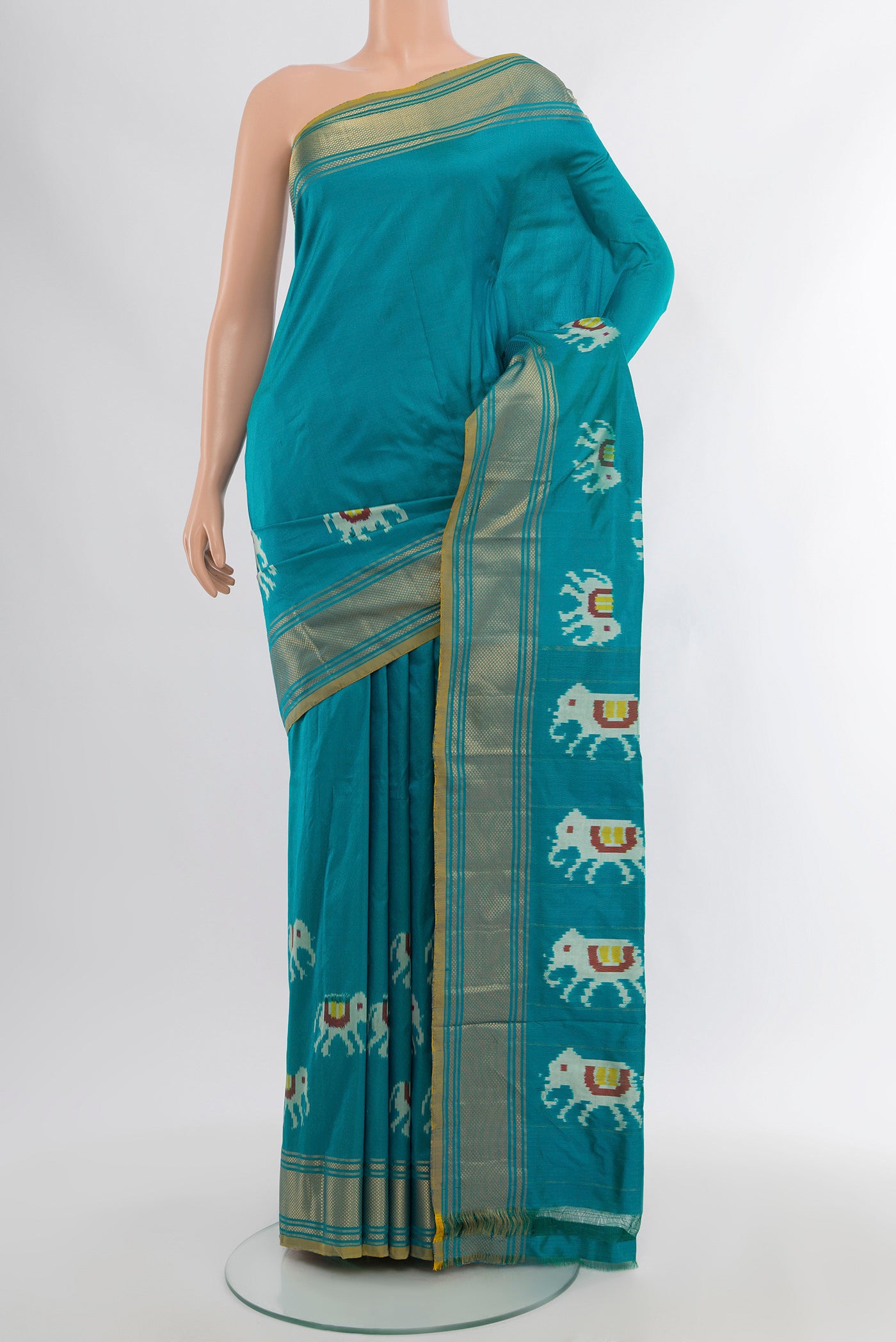 Light Blue Pochampally Silk Saree with Ikat design on the body and Zari Border.  displayed on a mannequin