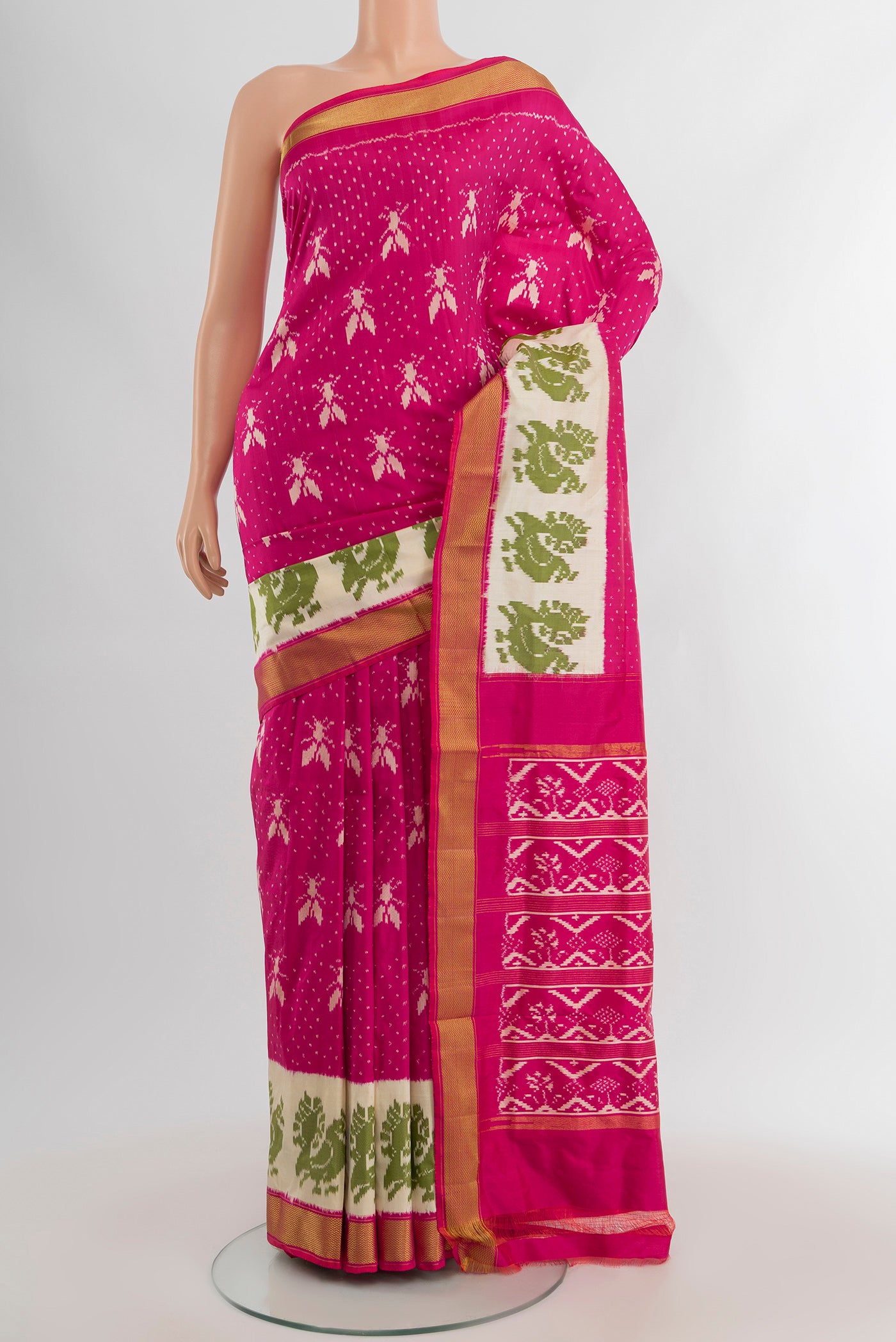Dark Pink Pochampally Silk Saree with Pure Ikat on the body and Zari Border.  displayed on a mannequin