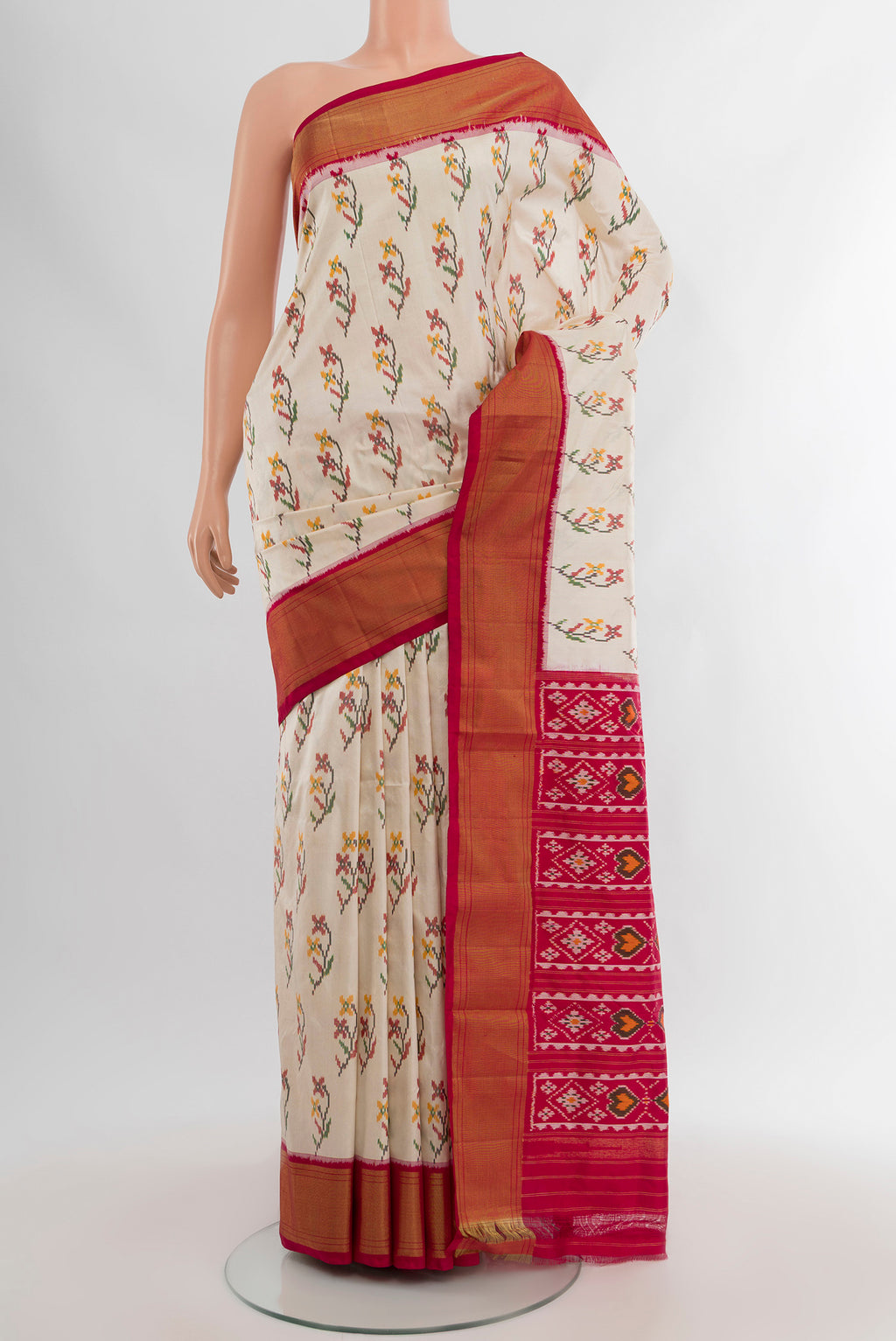 Cream Pochampally Silk Saree with Pure Ikat on the body and Zari Border.  displayed on a mannequin
