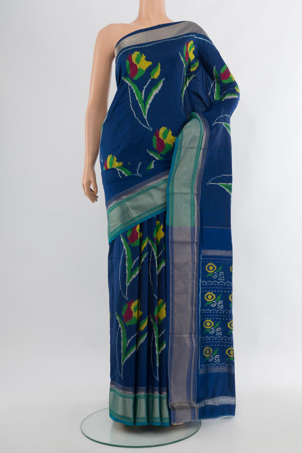 Dark Blue Pochampally Silk Saree with Pure Ikat on the body and Zari Border.  displayed on a mannequin