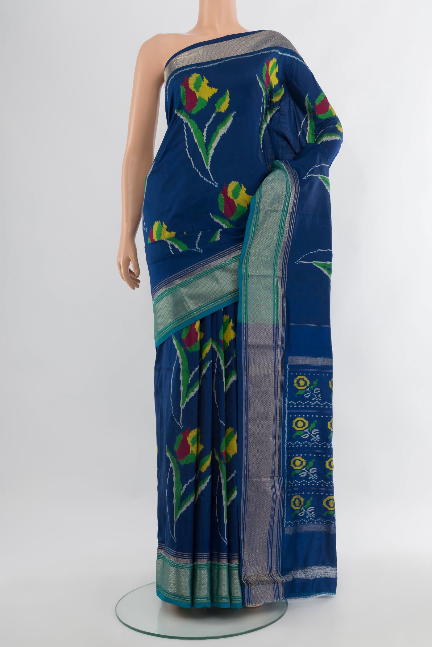 Dark Blue Pochampally Silk Saree with Pure Ikat on the body and Zari Border.  displayed on a mannequin