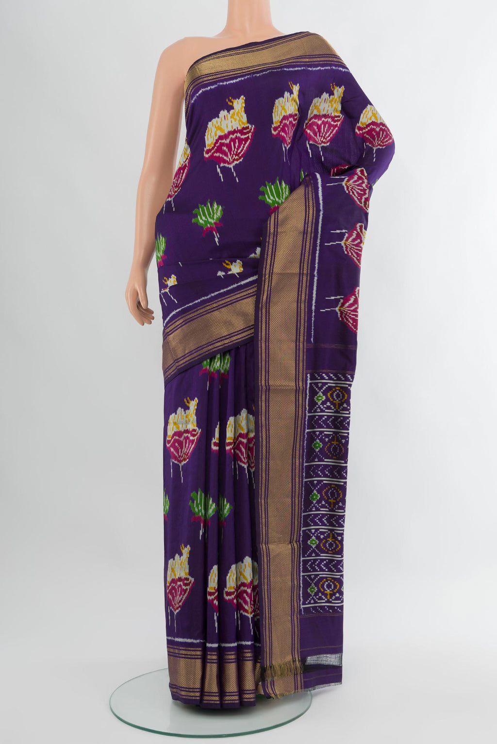 Violet Pochampally Silk Saree with Pure Ikat on the body and Zari Border.  displayed on a mannequin