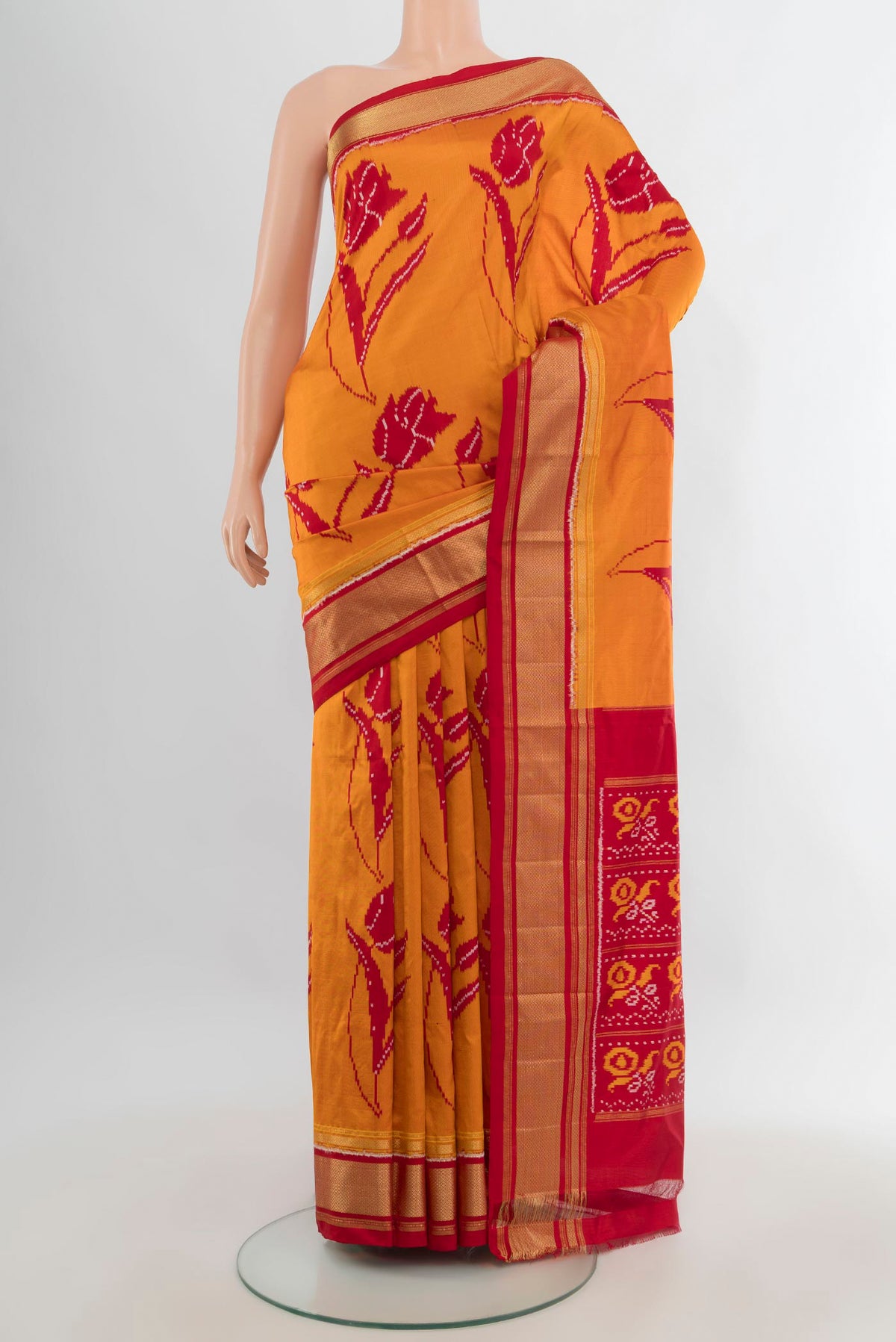 Pure Silk Yellow Pochampally Saree with Pure Ikat on the body and Zari Border.  displayed on a mannequin