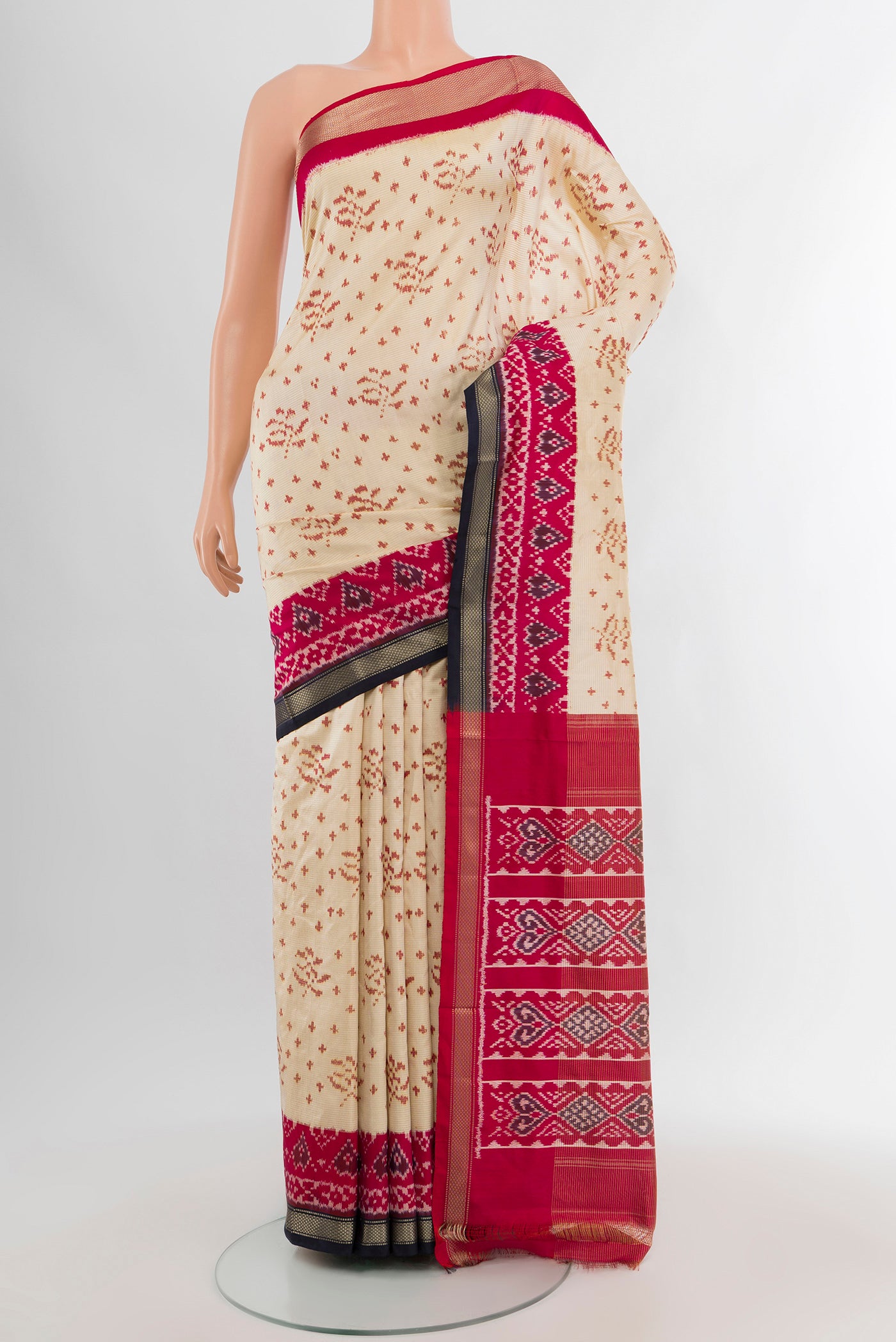 Cream Pochampally Silk Saree with Pure Ikat on the body and Zari Border.  displayed on a mannequin