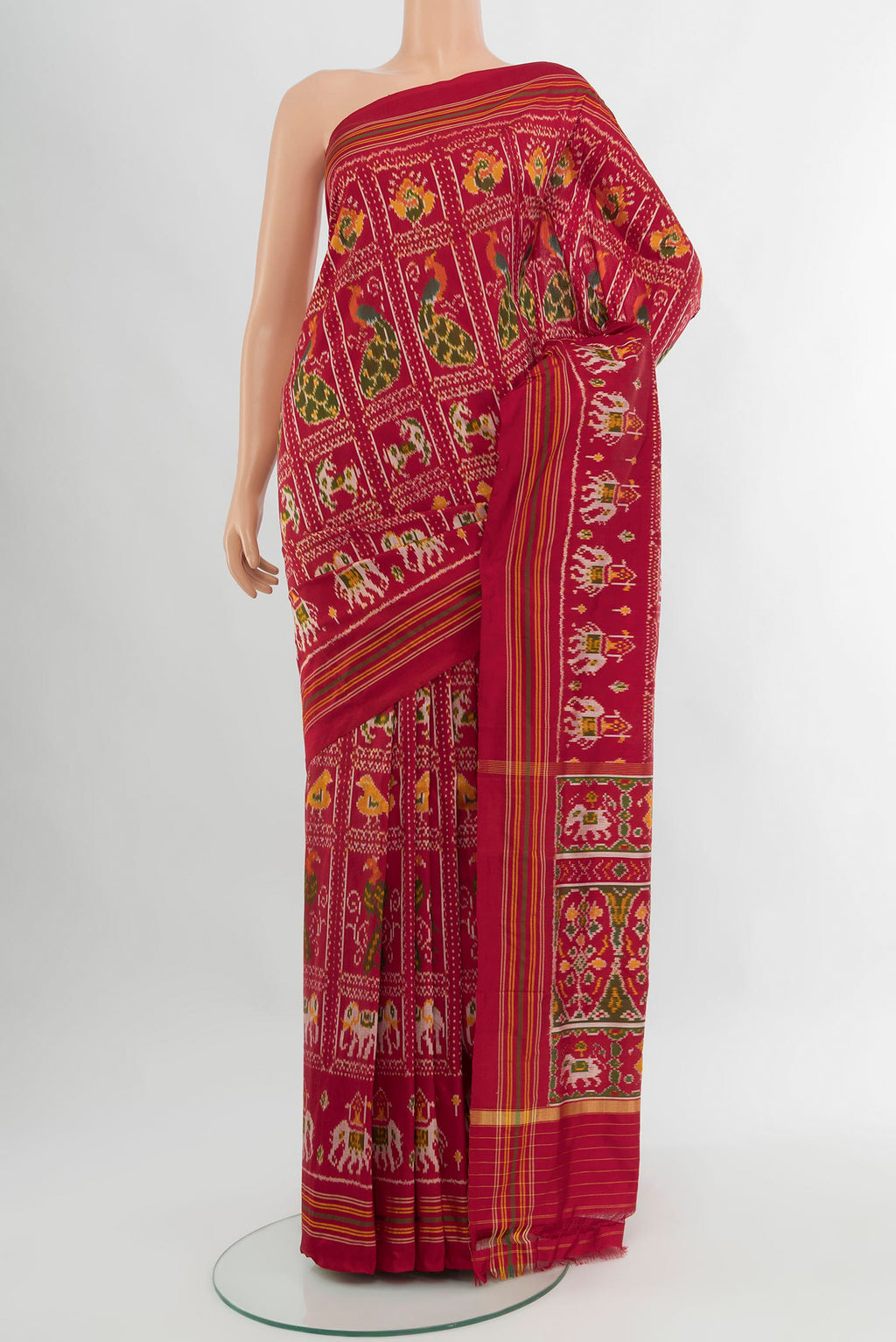 Maroon Pochampally Silk Saree with Pure Ikat on the body and Plain Border.  displayed on a mannequin