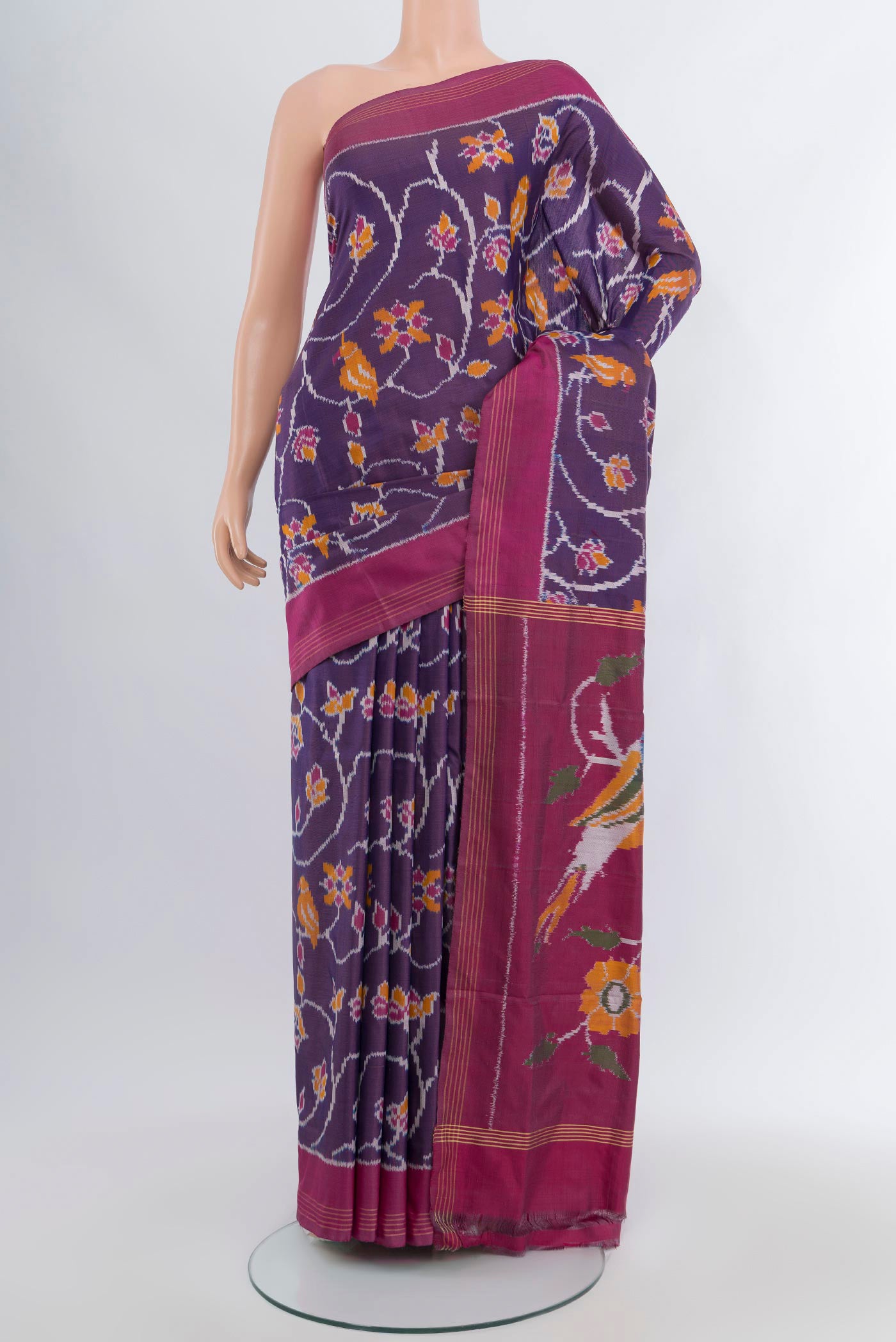 Violet Pochampally Silk Saree with Pure Ikat on the body and Plain Border.  displayed on a mannequin