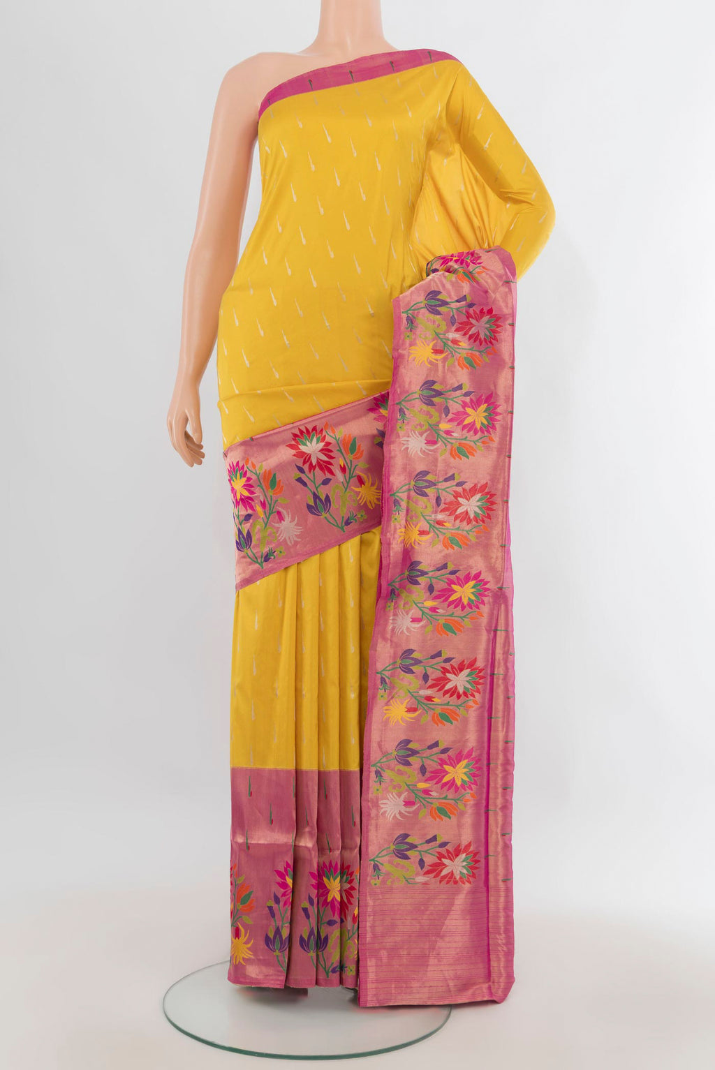 Pure Silk Yellow Banarasi Saree with Zari Butta on the body and Fancy Border.  displayed on a mannequin