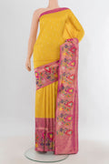 Pure Silk Yellow Banarasi Saree with Zari Butta on the body and Fancy Border.  displayed on a mannequin