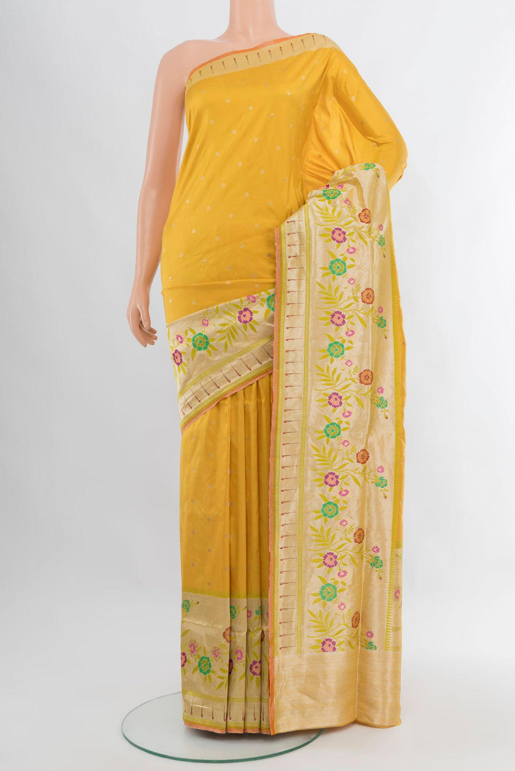 Yellow Banarasi Silk Saree with Zari Butta on the body and Zari Border.  displayed on a mannequin