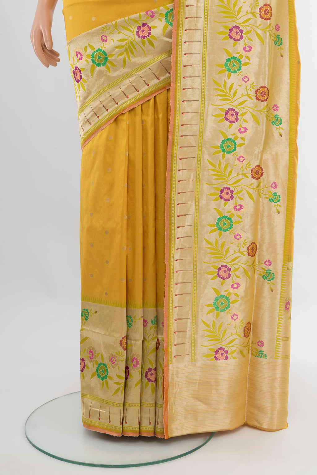 Pleats and pallu of Yellow Banarasi Silk Saree with Zari Butta on the body and Zari Border. 