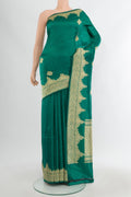 Teal Banarasi Katan Silk Saree with Zari Butta on the body and Zari Border.  displayed on a mannequin