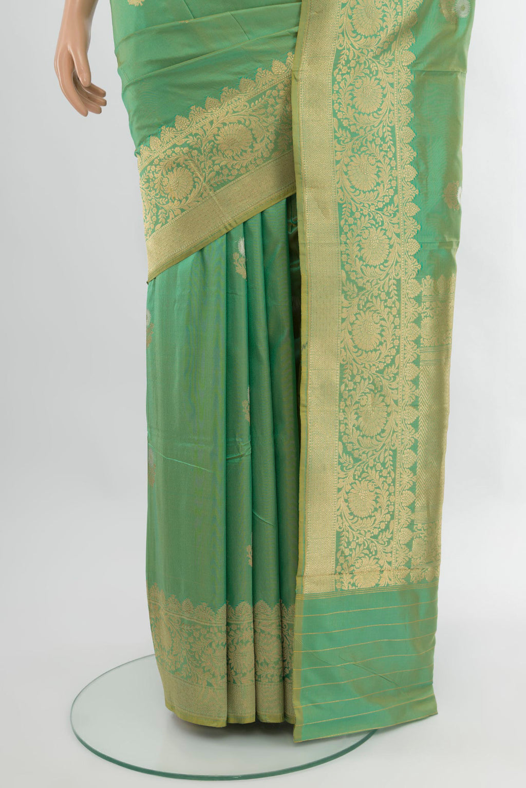 Pleats and pallu of Green Banarasi Katan Silk Saree with Zari Butta on the body and Zari Border. 