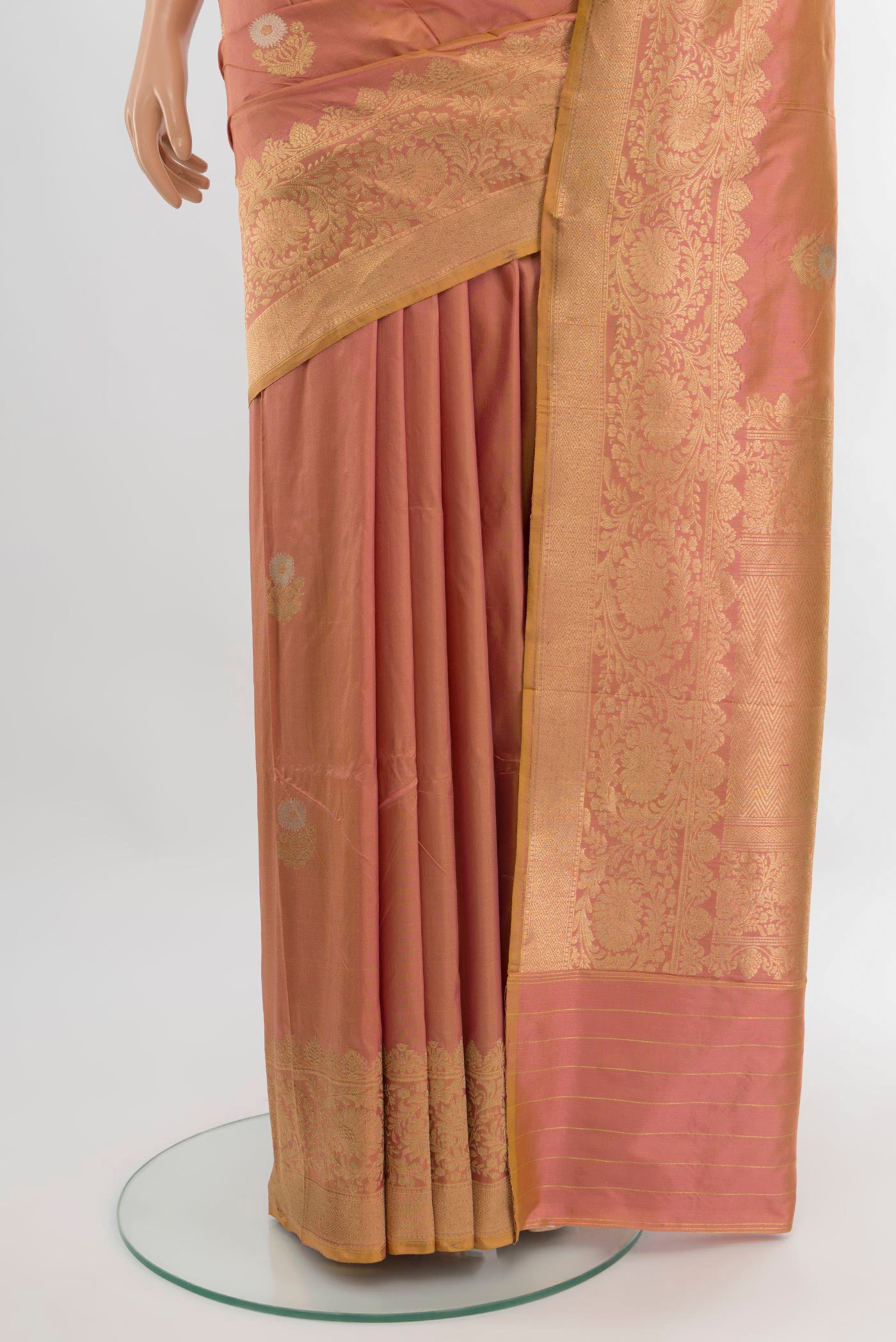 Pleats and pallu of Peach Banarasi Katan Silk Saree with Zari Butta on the body and Zari Border. 