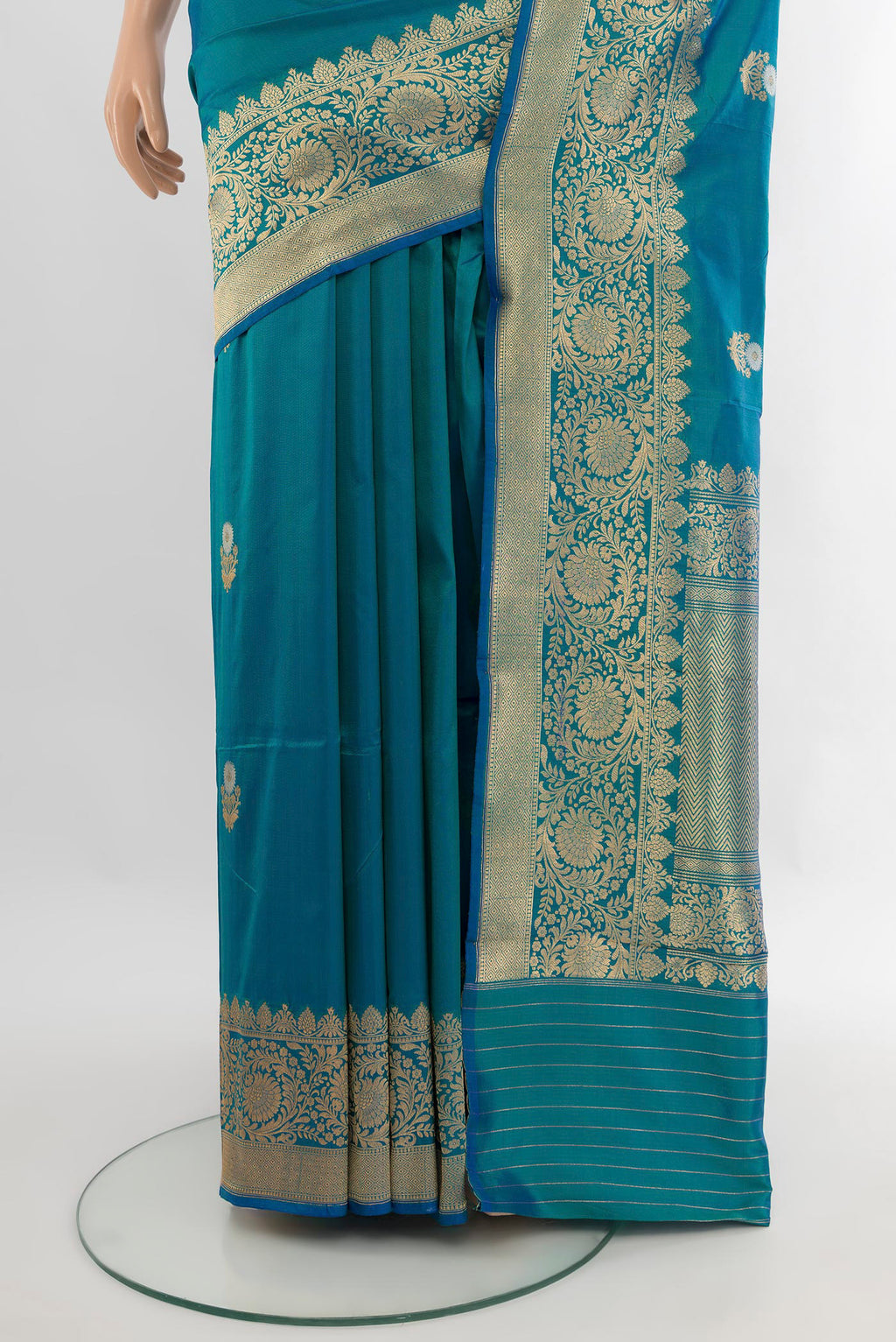 Pleats and pallu of Peacock Blue Banarasi Katan Silk Saree with Zari Butta on the body and Zari Border. 