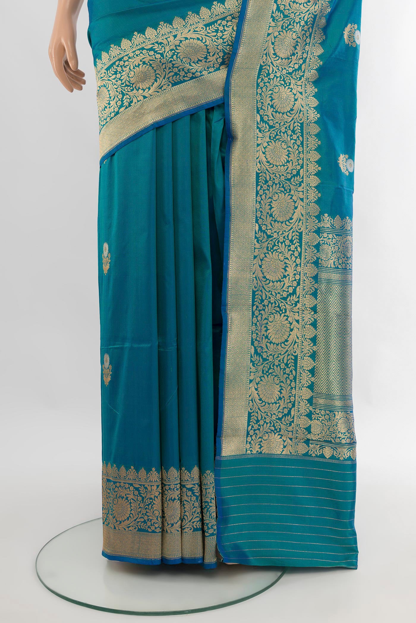 Pleats and pallu of Peacock Blue Banarasi Katan Silk Saree with Zari Butta on the body and Zari Border. 