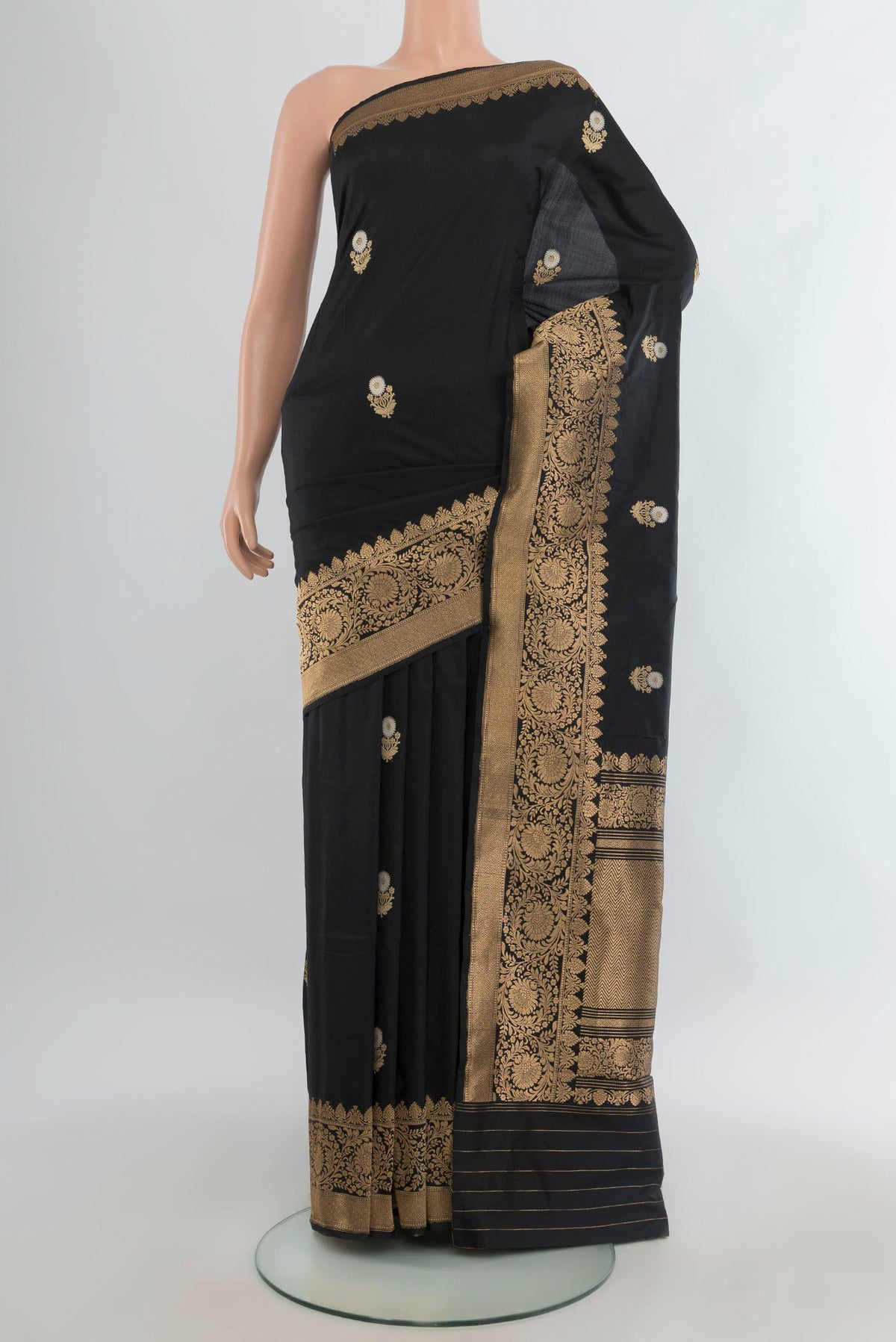 Pure Silk Black Banarasi Katan Saree with Zari Butta on the body and Zari Border.  displayed on a mannequin