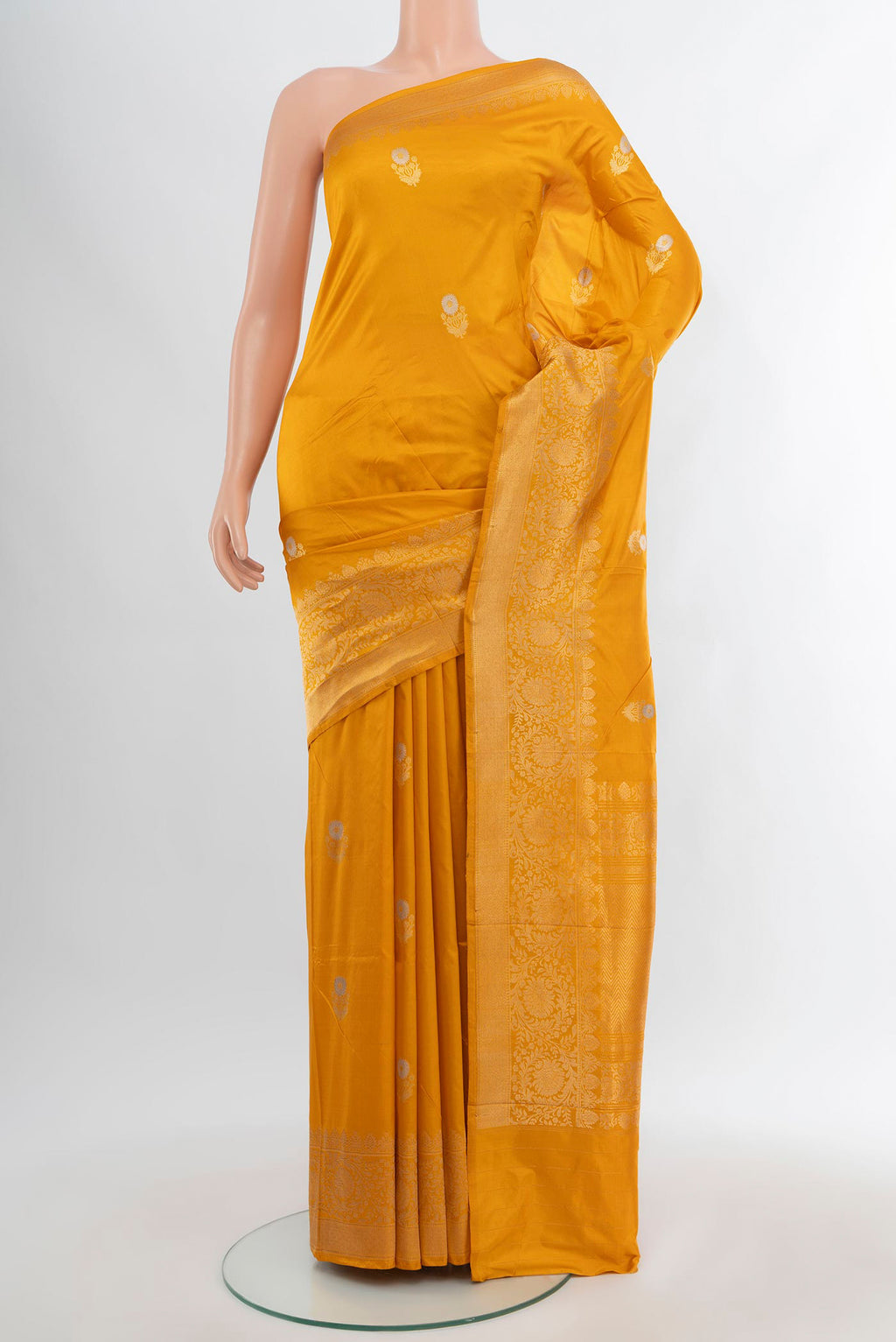 Yellow Banarasi Katan Silk Saree with Zari Butta on the body and Zari Border.  displayed on a mannequin