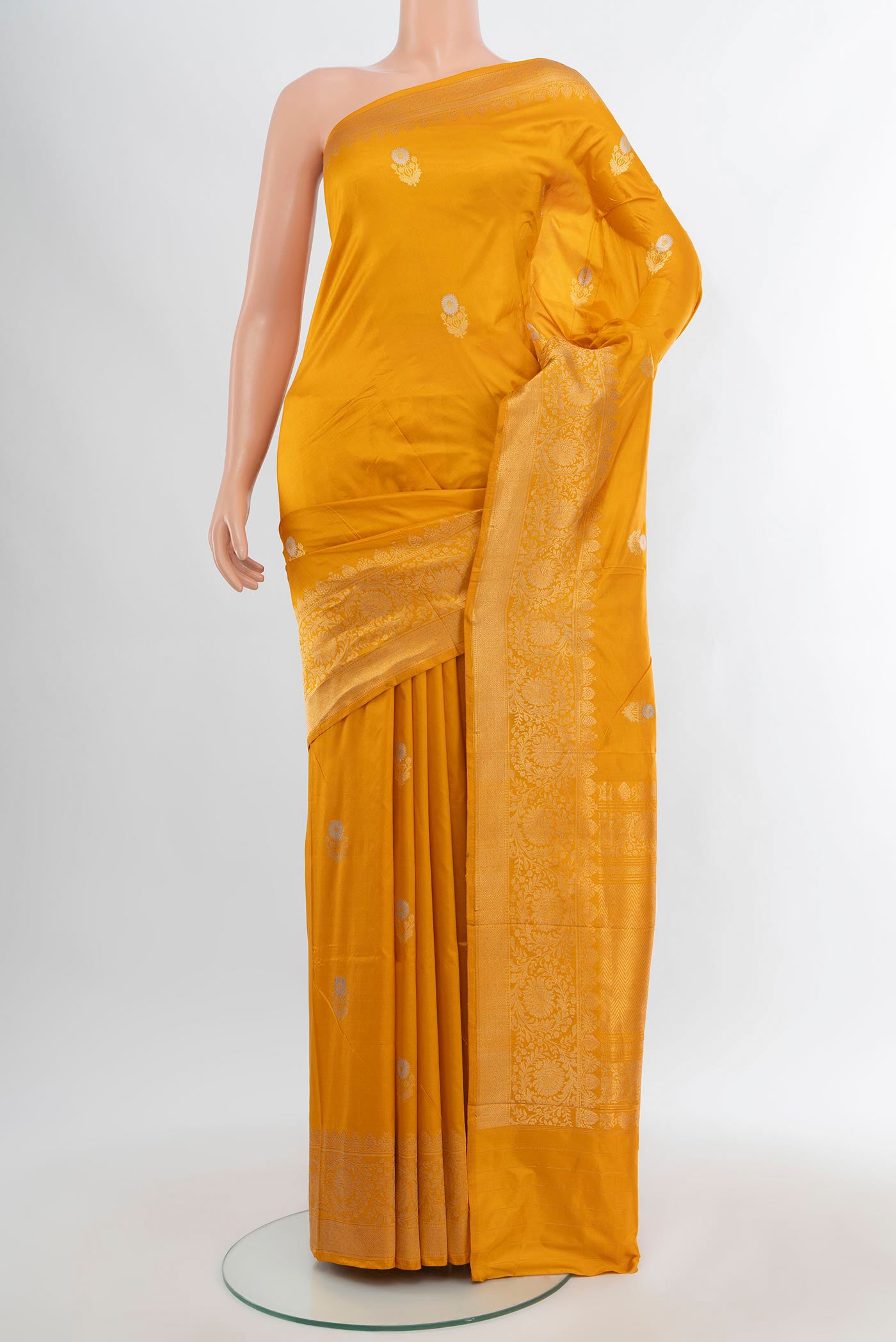 Yellow Banarasi Katan Silk Saree with Zari Butta on the body and Zari Border.  displayed on a mannequin