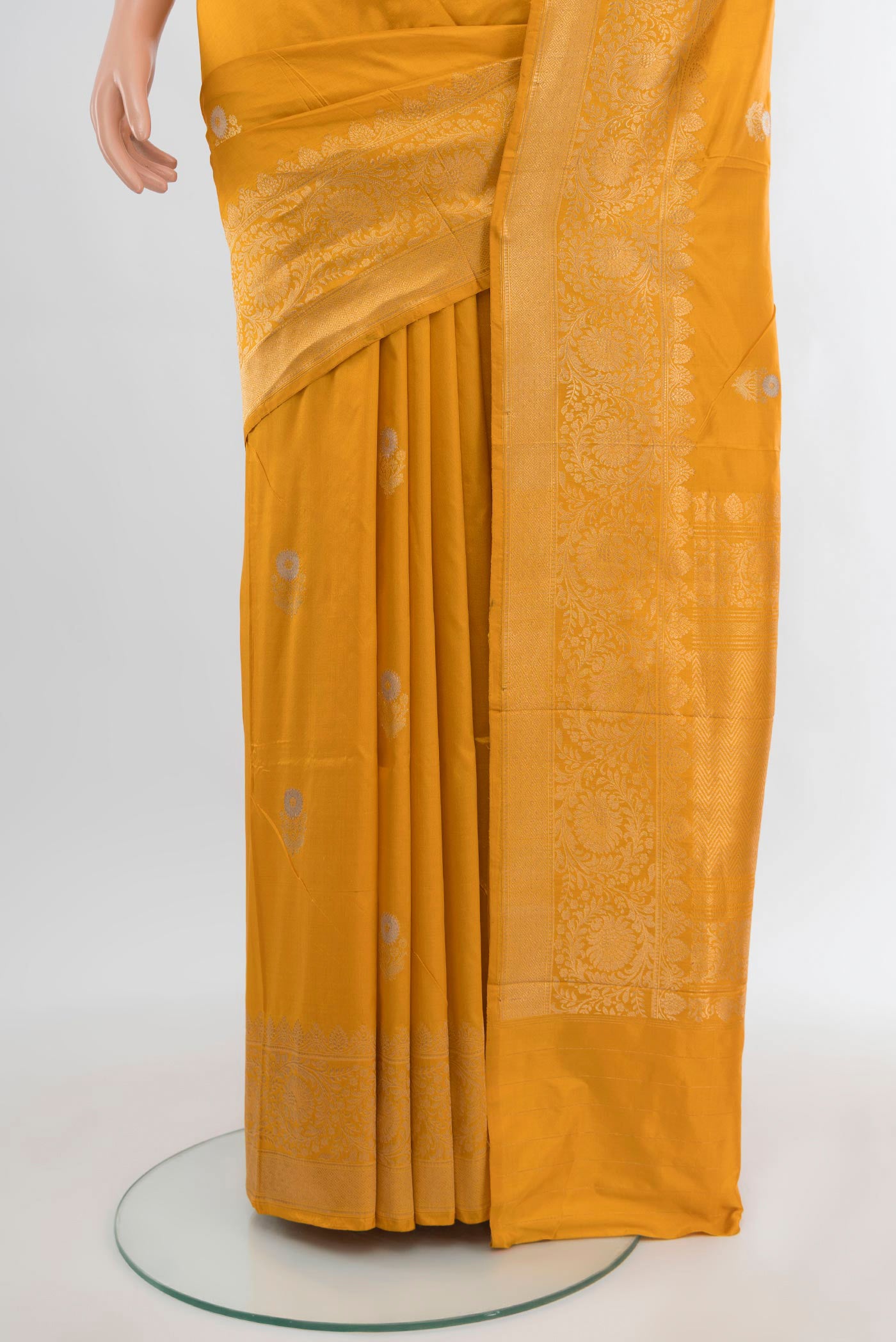 Pleats and pallu of Yellow Banarasi Katan Silk Saree with Zari Butta on the body and Zari Border. 