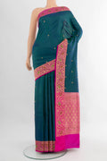 Peacock Blue Banarasi Katan Silk Saree with Zari Butta on the body and Zari Border.  displayed on a mannequin