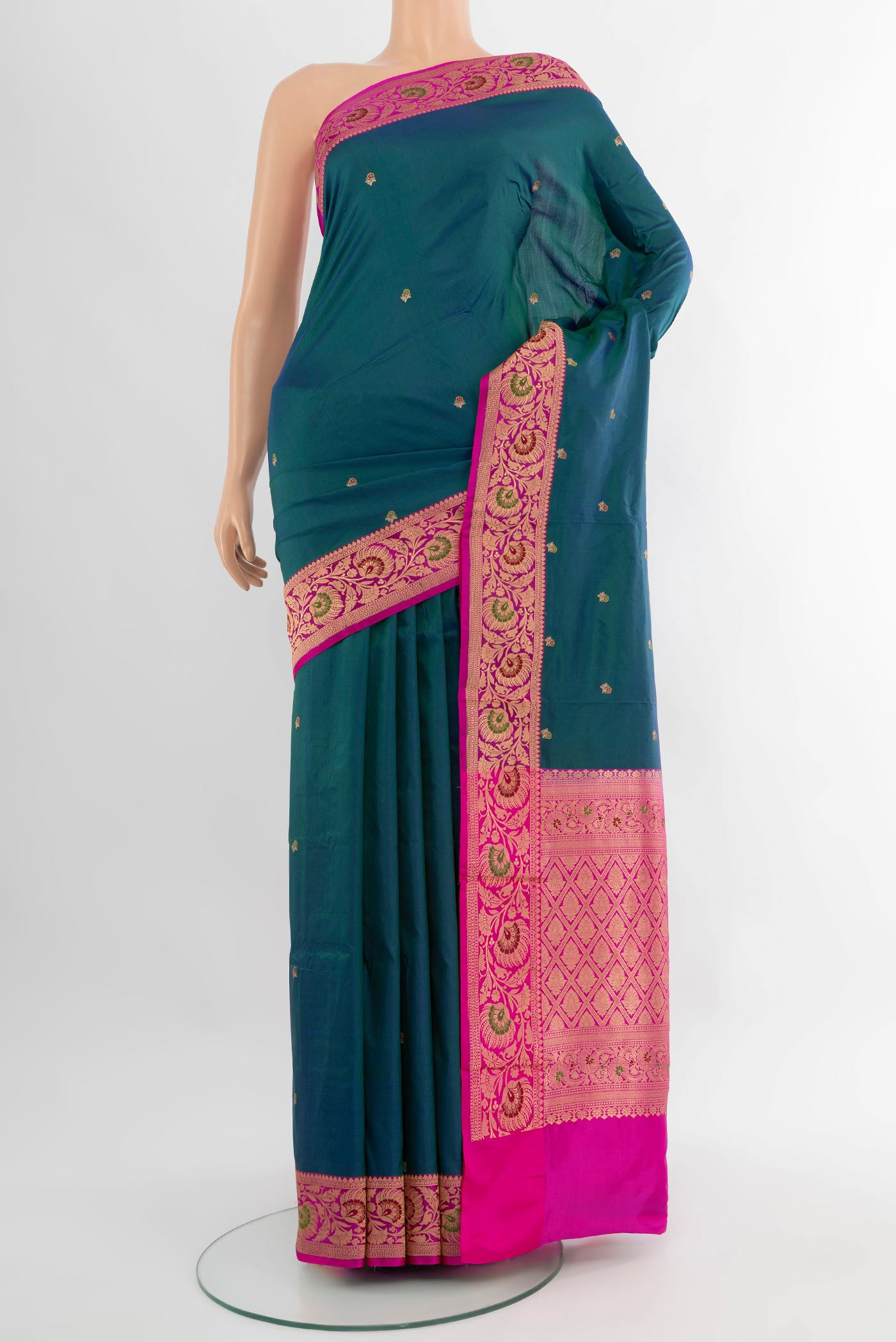 Peacock Blue Banarasi Katan Silk Saree with Zari Butta on the body and Zari Border.  displayed on a mannequin