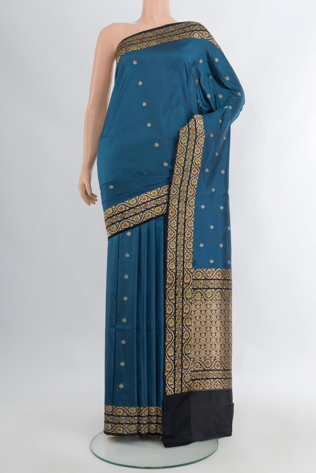 Dark Blue Banarasi Katan Silk Saree with Zari Butta on the body and Zari Border.  displayed on a mannequin