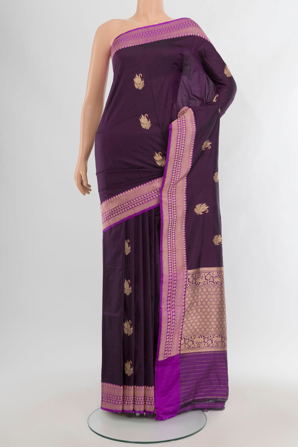 Violet Banarasi Katan Silk Saree with Zari Butta on the body and Zari Border.  displayed on a mannequin