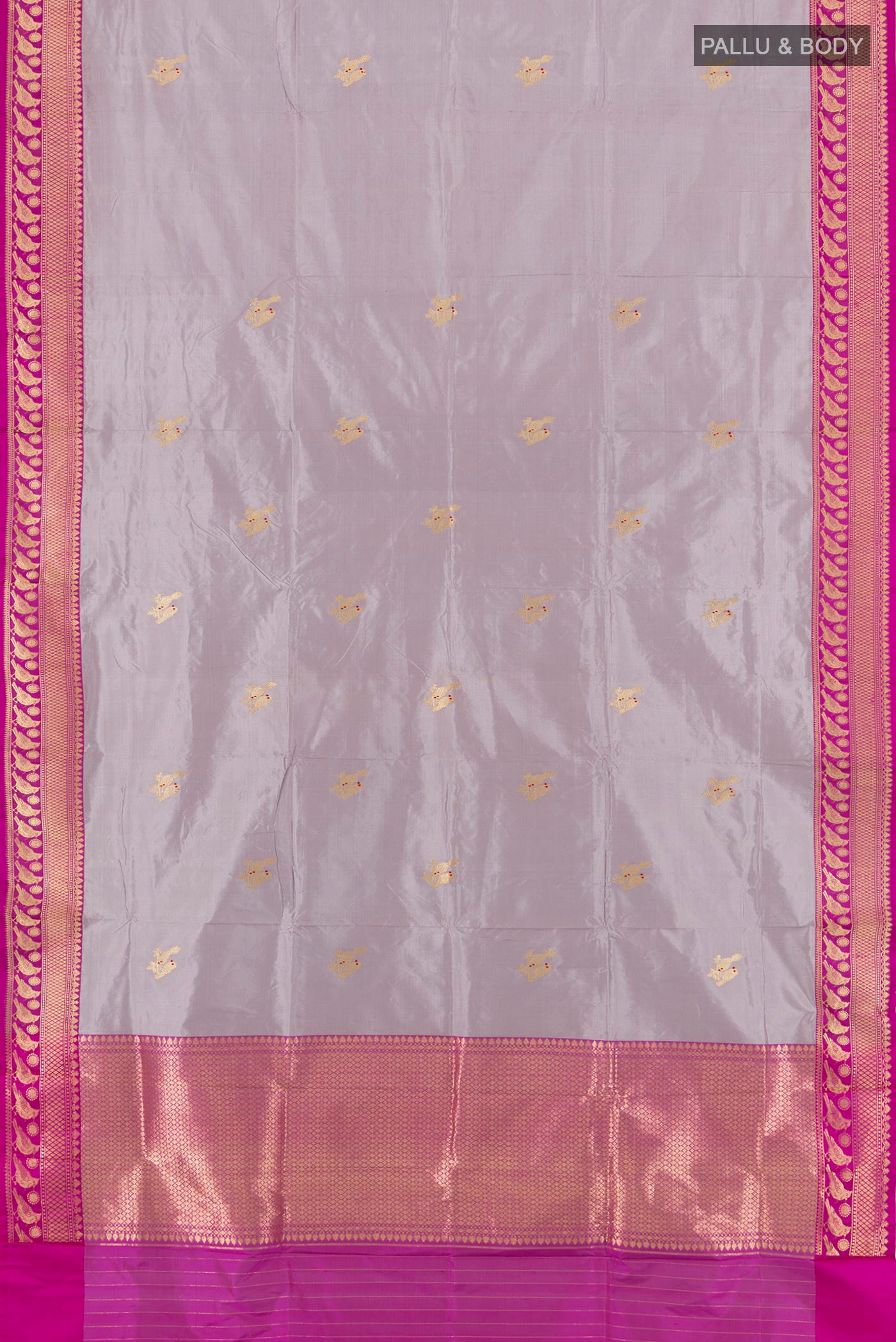 Flat view of Lilac Banarasi Katan Silk Saree with Zari Butta on the body and Zari Border. 