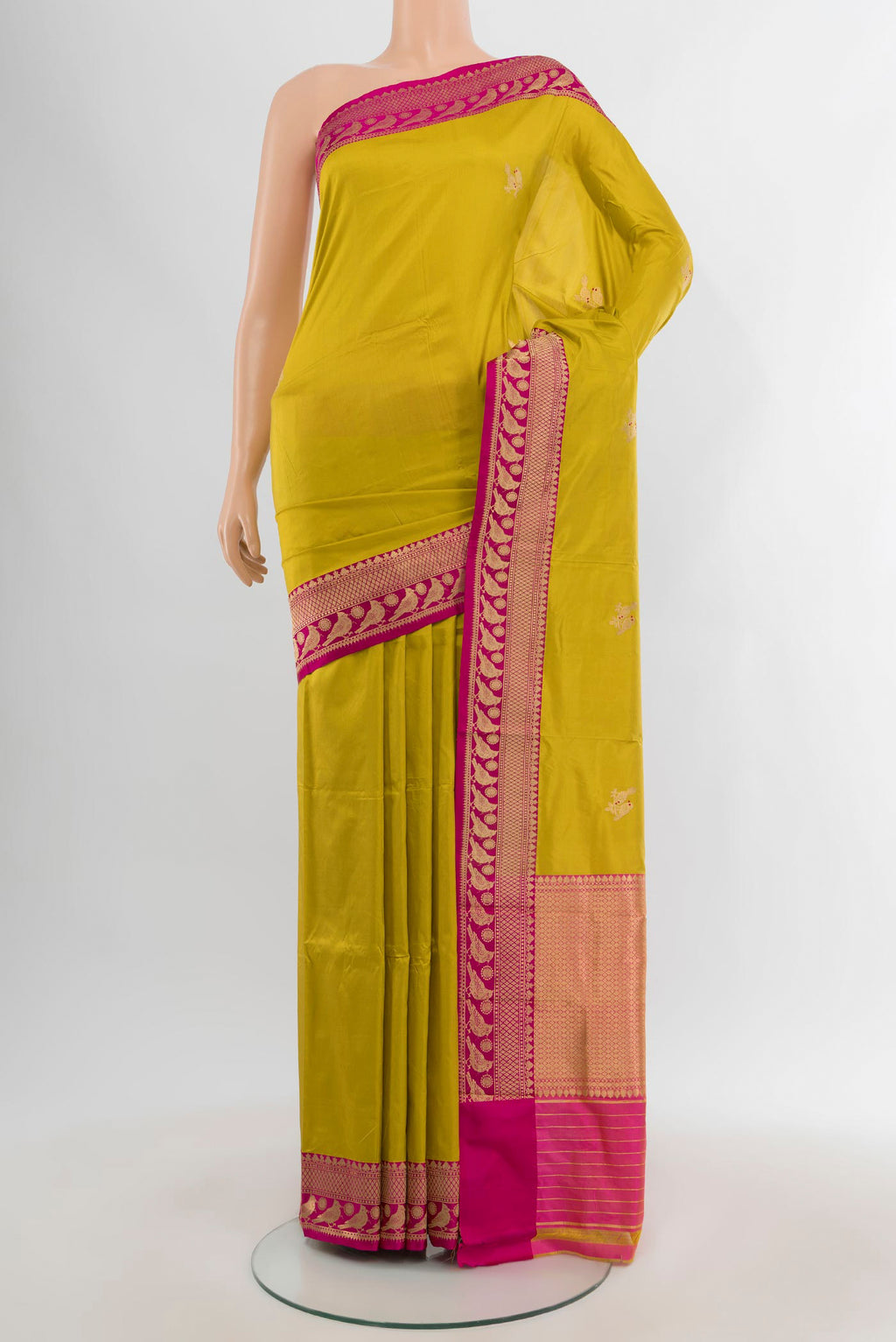 Acid Green Banarasi Katan Silk Saree with Zari Butta on the body and Zari Border.  displayed on a mannequin