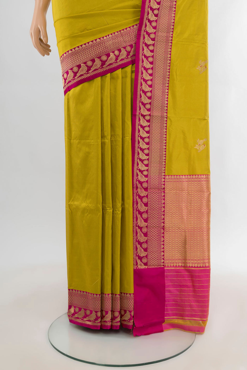 Pleats and pallu of Acid Green Banarasi Katan Silk Saree with Zari Butta on the body and Zari Border. 