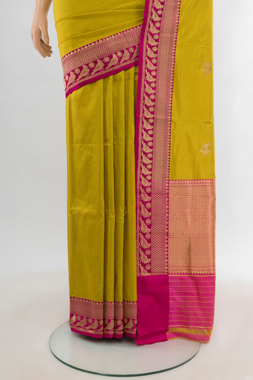 Pleats and pallu of Acid Green Banarasi Katan Silk Saree with Zari Butta on the body and Zari Border. 