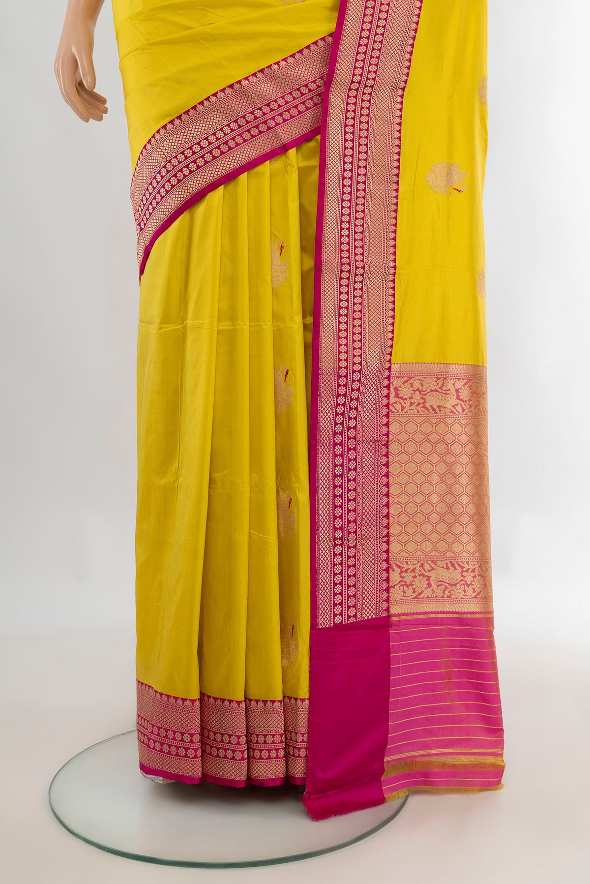 Pleats and pallu of Pure Silk Yellow Banarasi Katan Saree with Zari Butta on the body and Zari Border. 