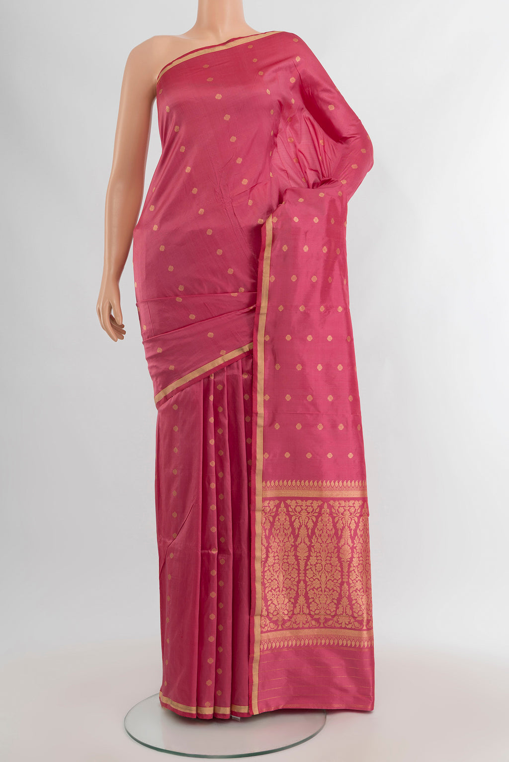 Rose pink Banarasi Katan Silk Saree with Zari Butta on the body and Zari Border.  displayed on a mannequin