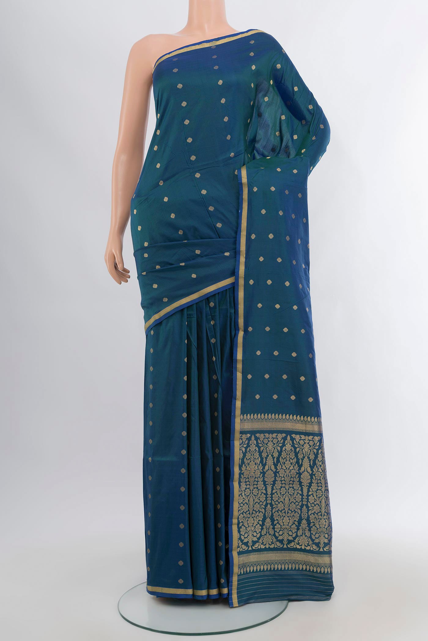 Peacock Blue Banarasi Katan Silk Saree with Zari Butta on the body and Zari Border.  displayed on a mannequin