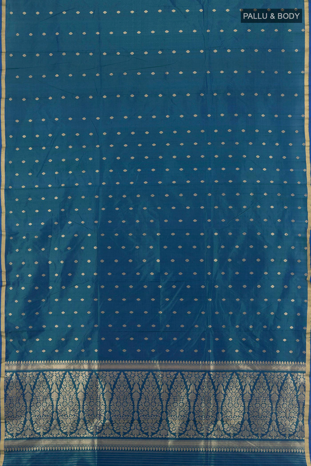 Flat view of Peacock Blue Banarasi Katan Silk Saree with Zari Butta on the body and Zari Border. 