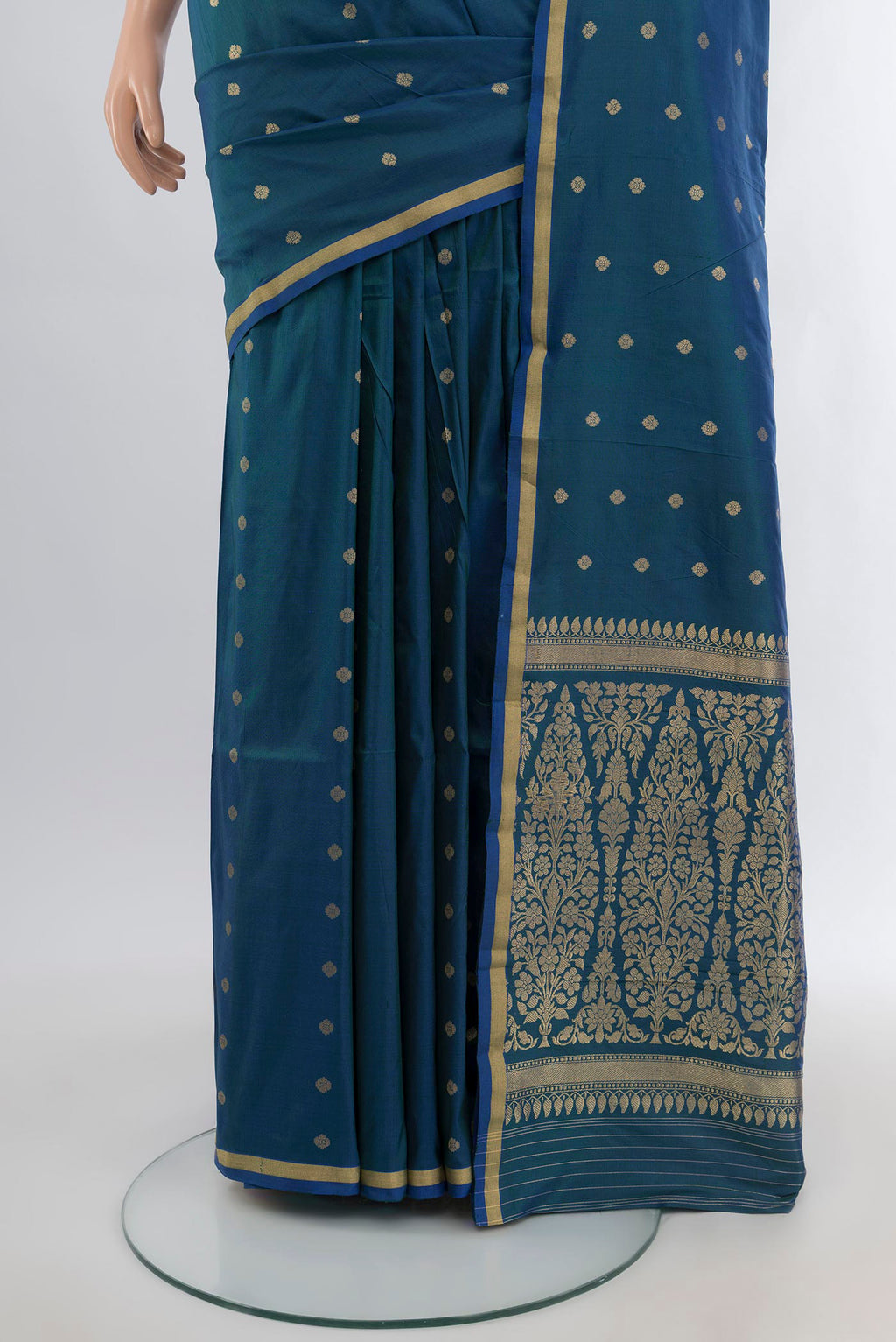 Pleats and pallu of Peacock Blue Banarasi Katan Silk Saree with Zari Butta on the body and Zari Border. 