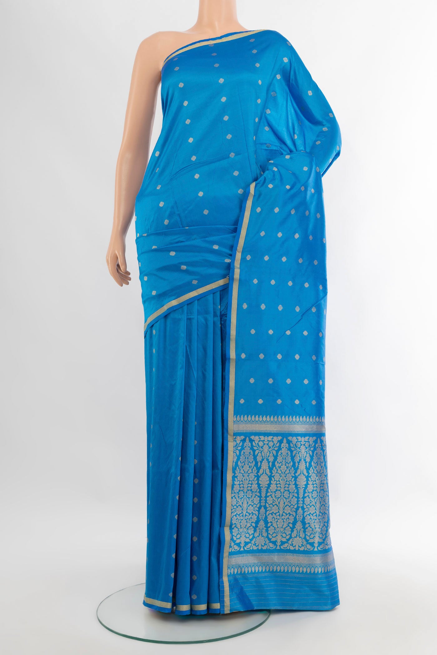 Sky Blue Banarasi Katan Silk Saree with Zari Butta on the body and Zari Border.  displayed on a mannequin