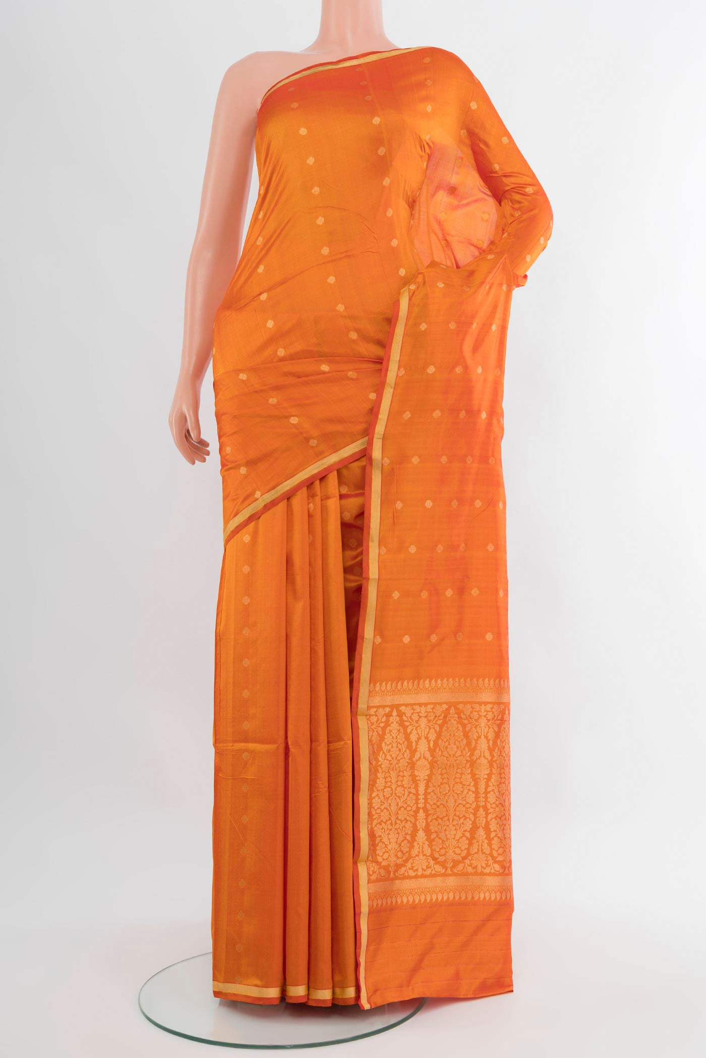 Yellow Banarasi Katan Silk Saree with Zari Butta on the body and Zari Border.  displayed on a mannequin