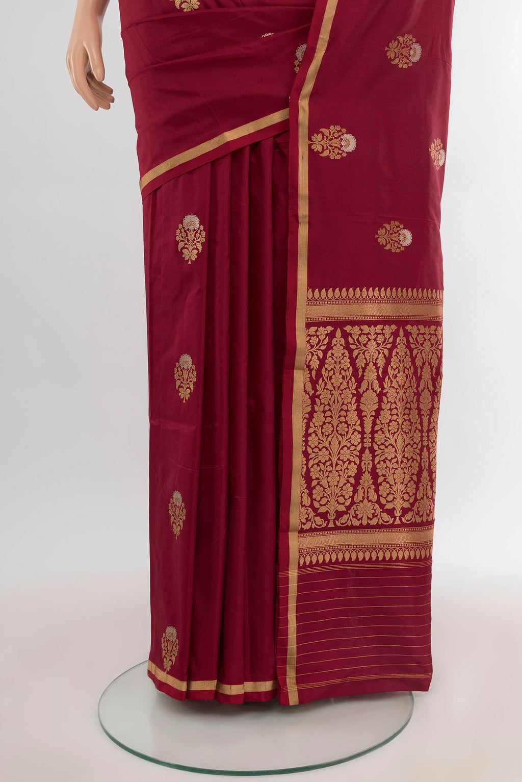 Pleats and pallu of Maroon Banarasi Katan Silk Saree with Zari Butta on the body and Zari Border. 