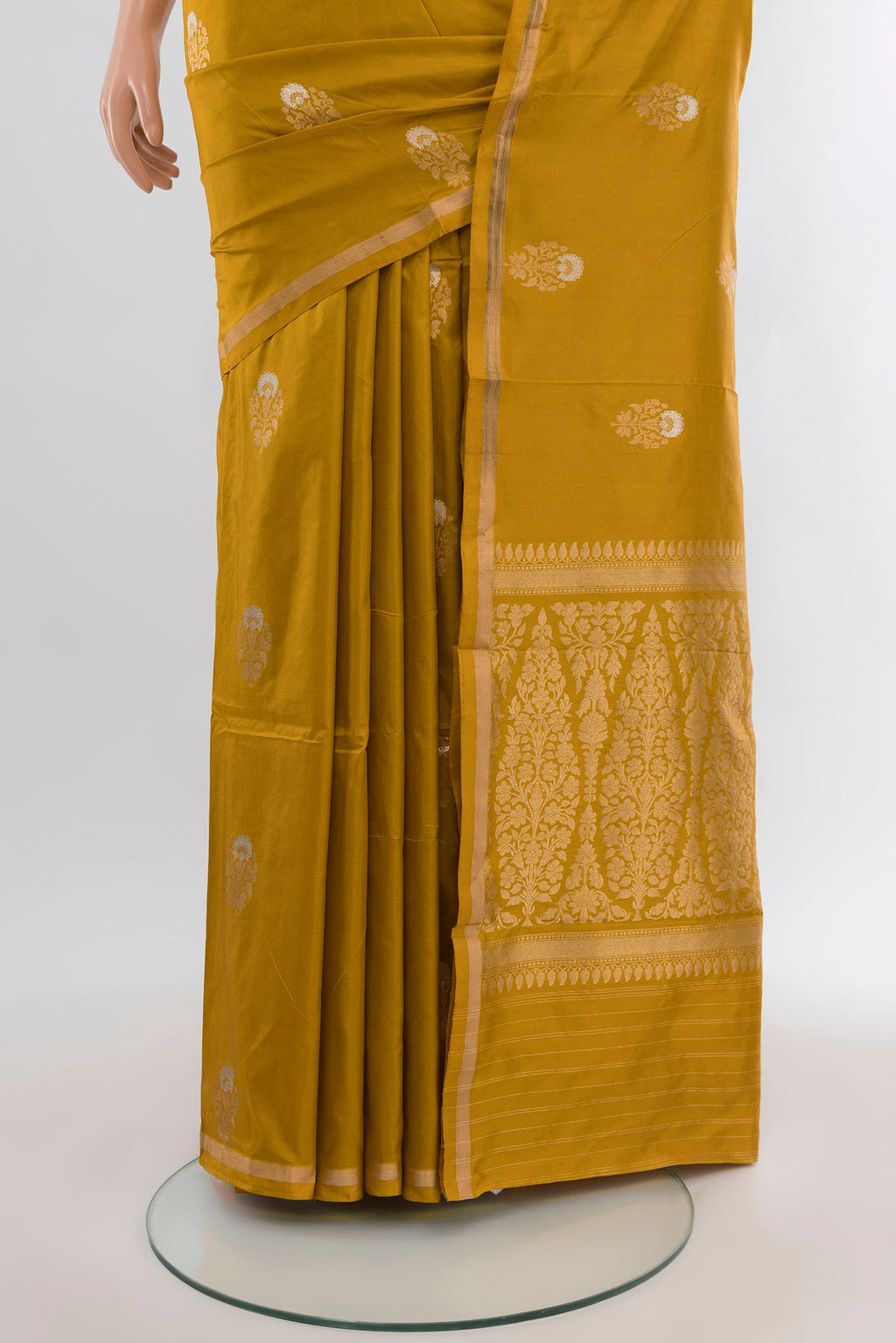 Pleats and pallu of Mustard Banarasi Katan Silk Saree with Zari Butta on the body and Zari Border. 