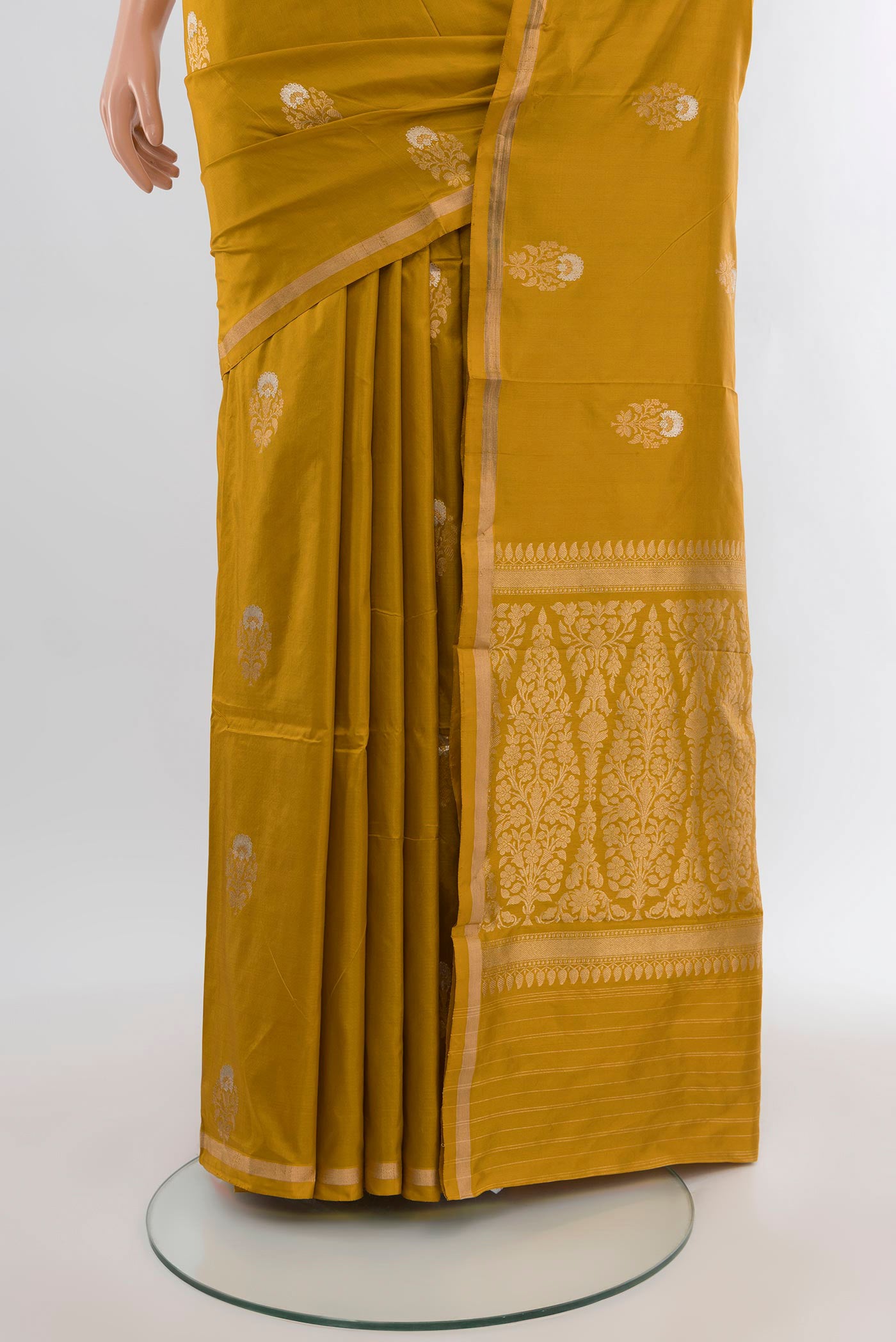 Pleats and pallu of Mustard Banarasi Katan Silk Saree with Zari Butta on the body and Zari Border. 
