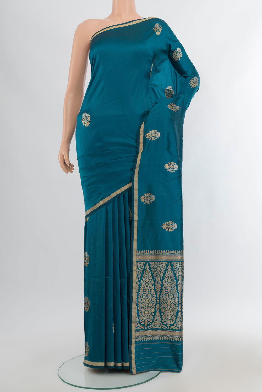 Blue Banarasi Katan Silk Saree with Zari Butta on the body and Zari Border.  displayed on a mannequin