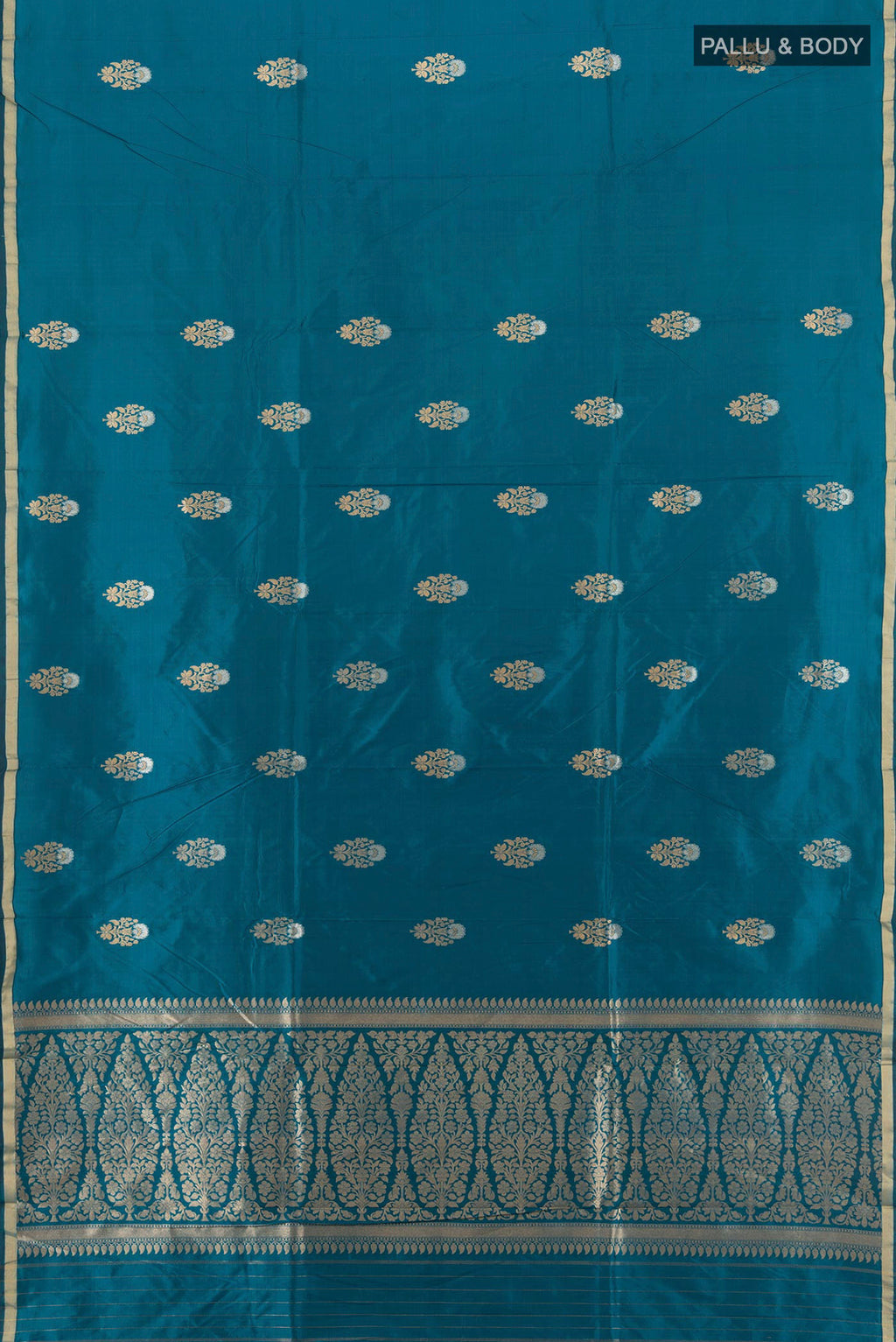 Flat view of Blue Banarasi Katan Silk Saree with Zari Butta on the body and Zari Border. 
