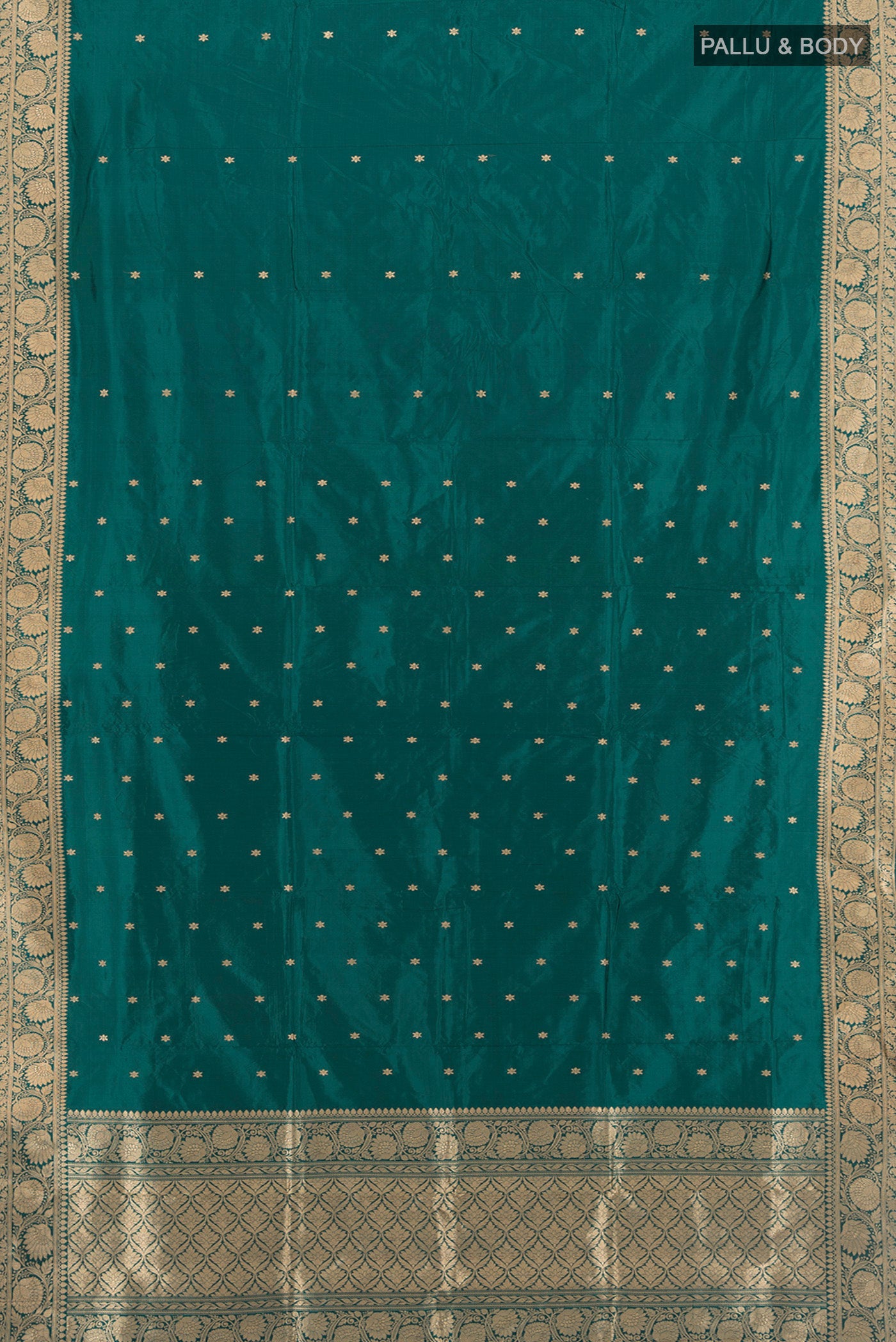 Flat view of Teal Banarasi Katan Silk Saree with Zari Butta on the body and Zari Border. 