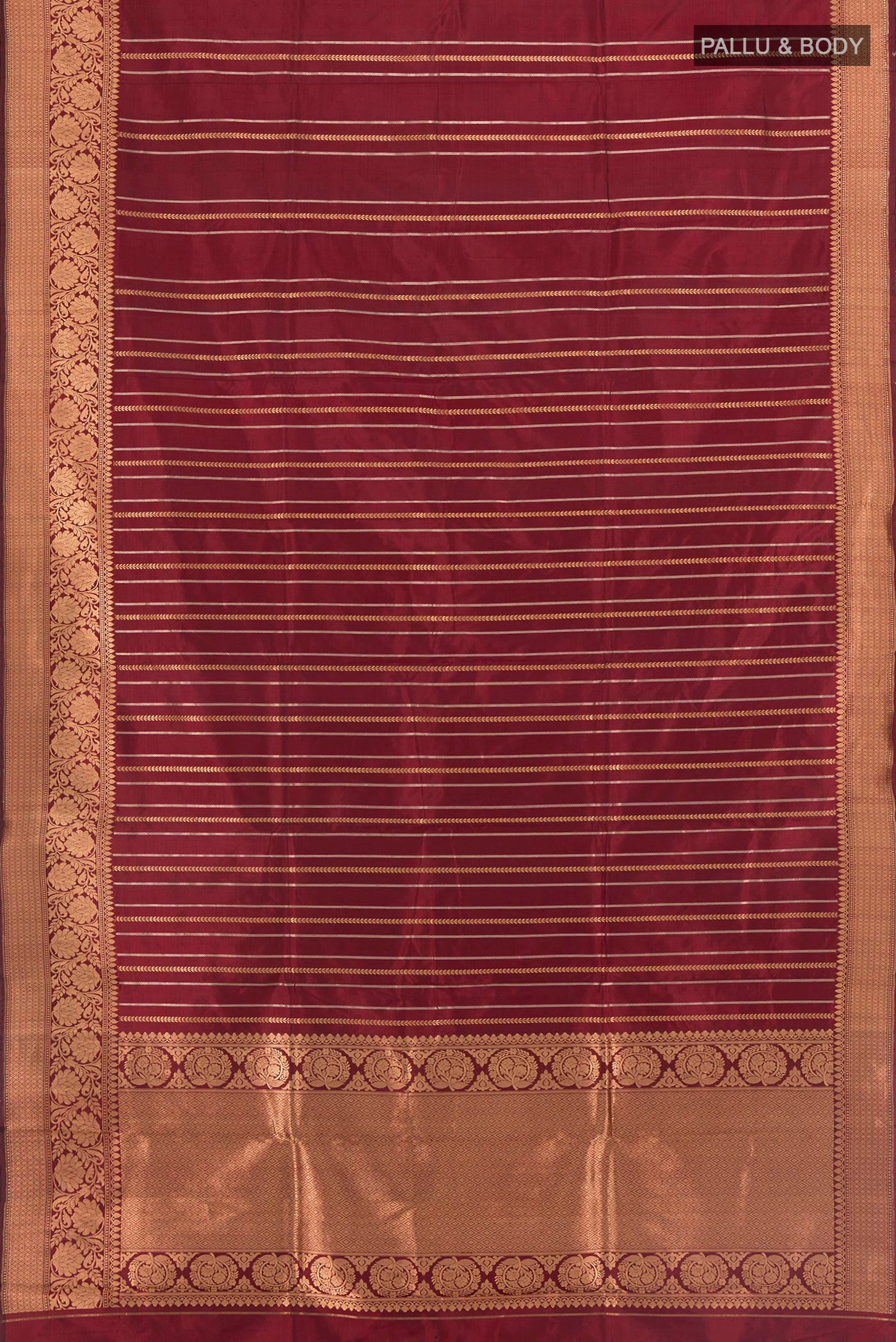 Flat view of Maroon Banarasi Katan Silk Saree with Stripes on the body and Zari Border. 