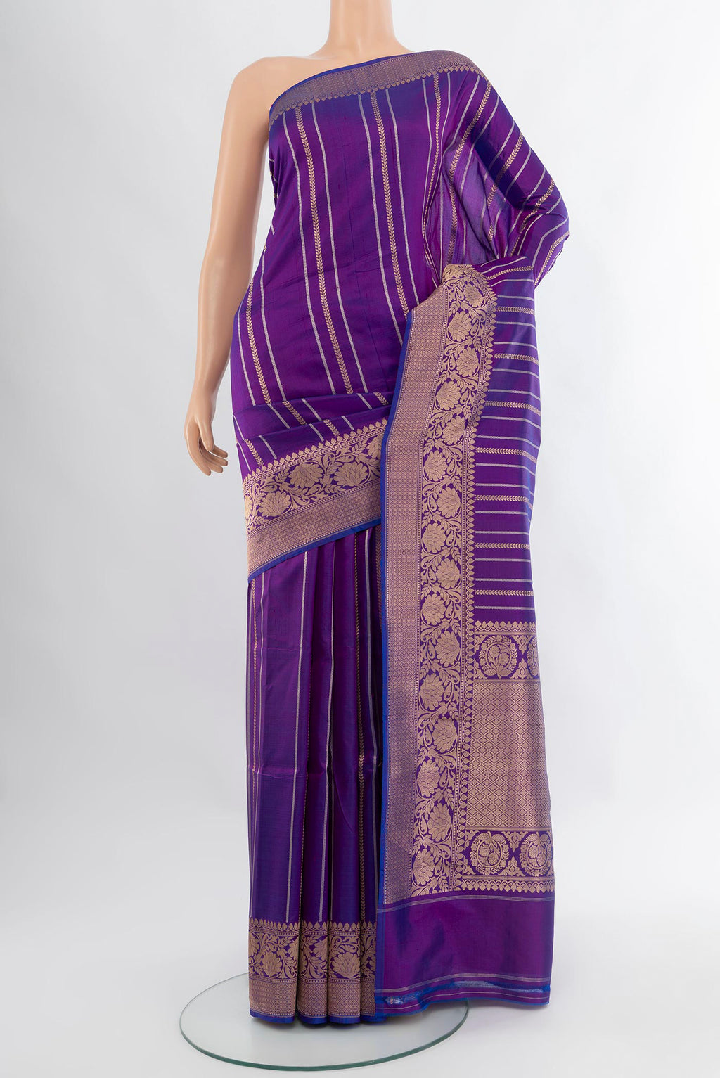 Purple Banarasi Katan Silk Saree with Stripes on the body and Zari Border.  displayed on a mannequin