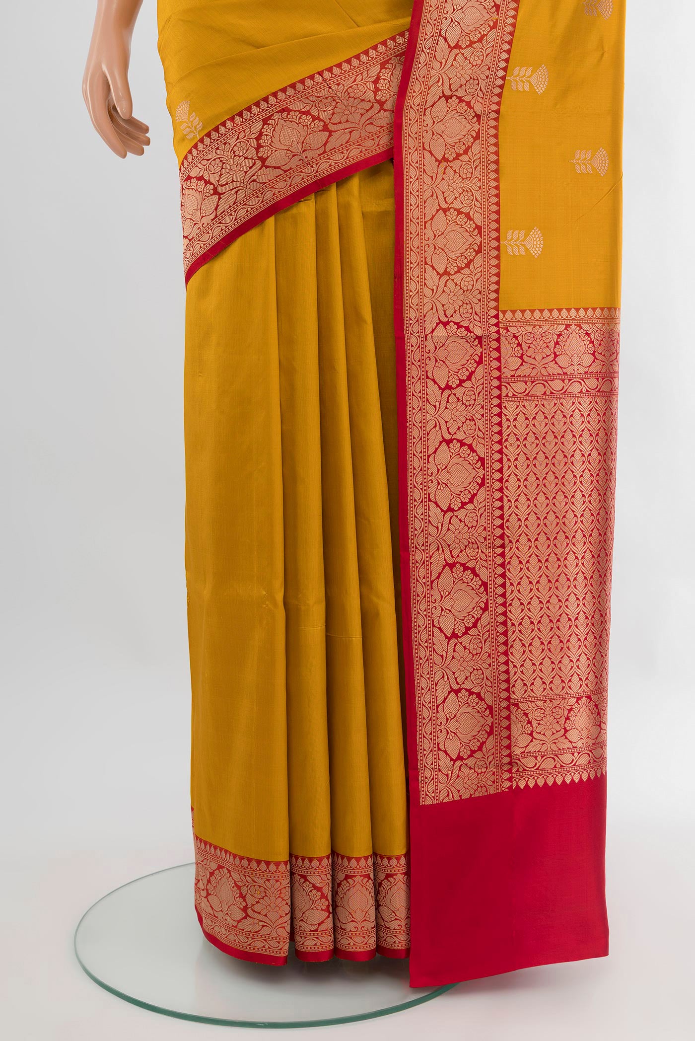 Pleats and pallu of Mustard Banarasi Katan Silk Saree with Zari Butta on the body and Zari Border. 